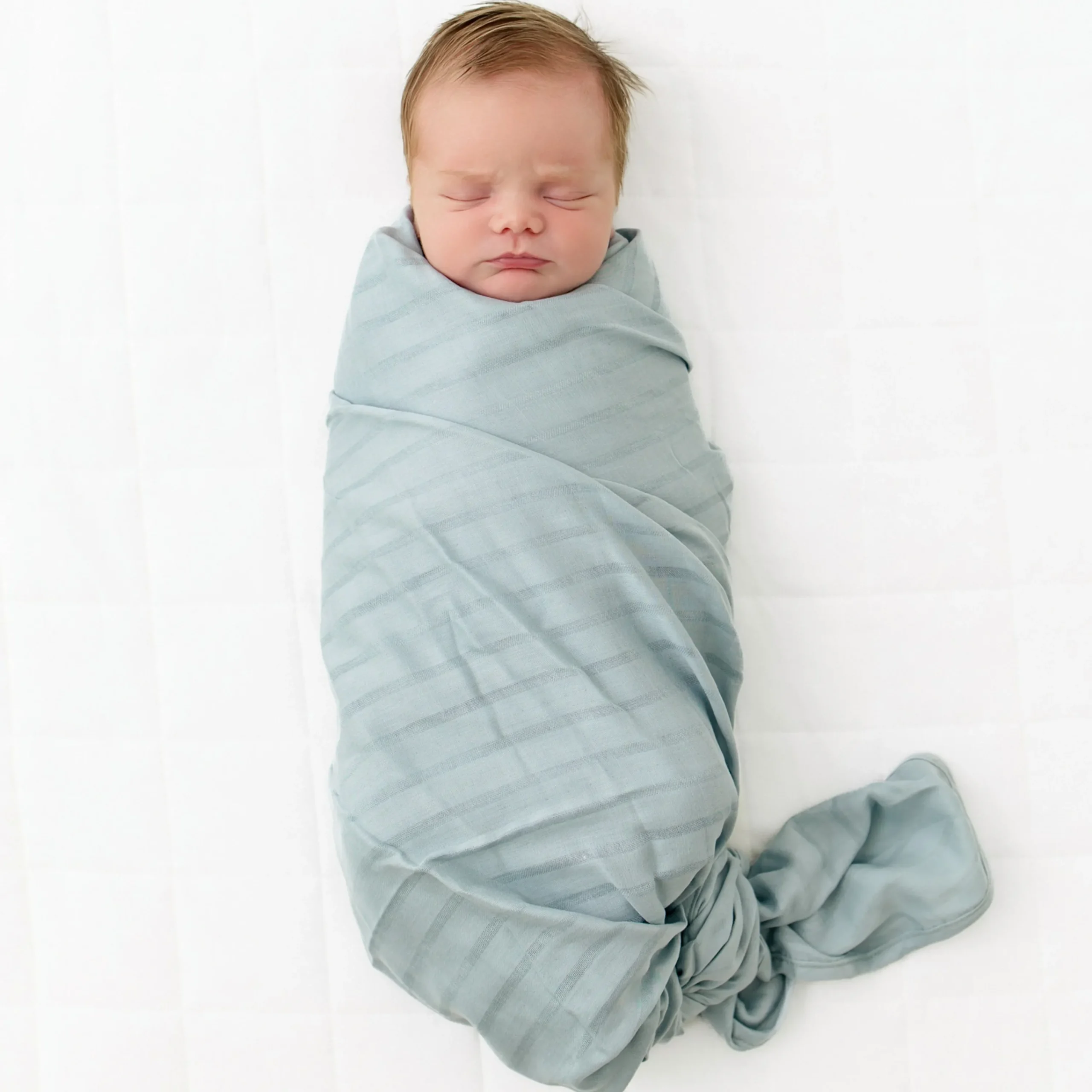 Kyte Baby Bamboo Muslin Swaddle Blanket in Mist Hot