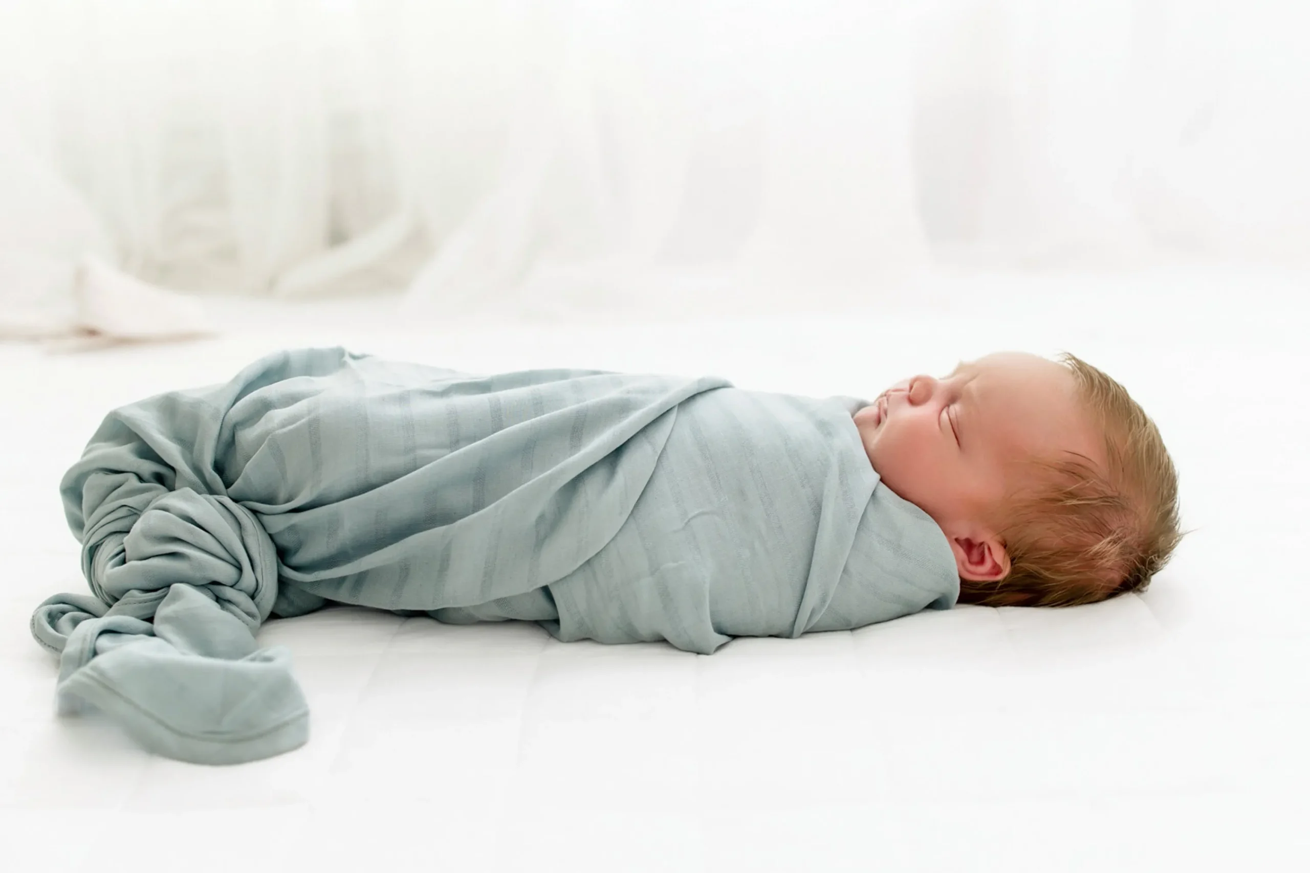 Kyte Baby Bamboo Muslin Swaddle Blanket in Mist Hot