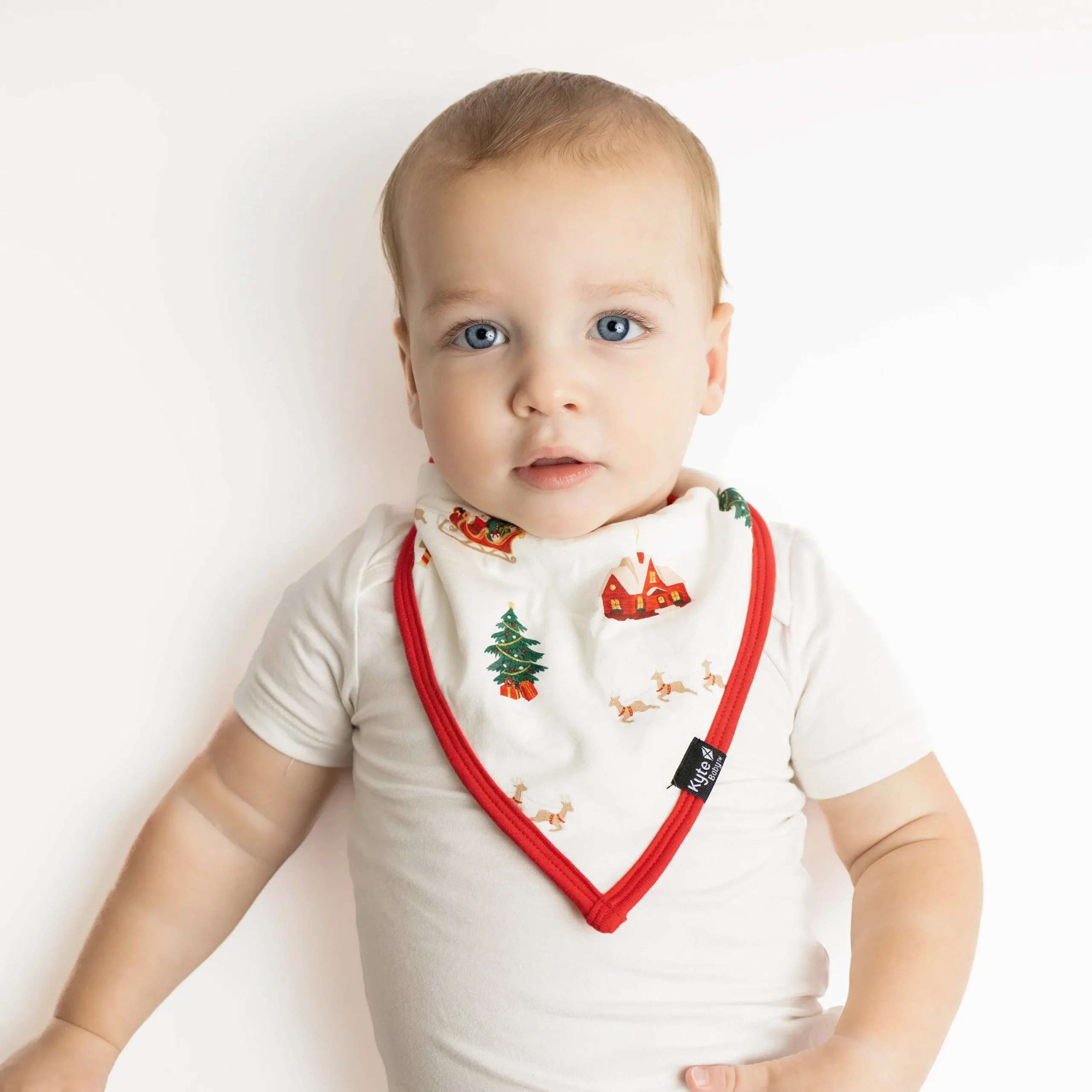 Kyte Baby Bib in Santa Sleigh Outlet