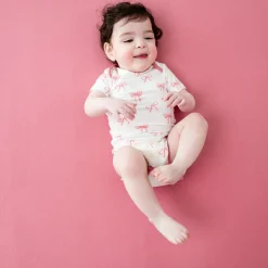 Kyte Baby Bodysuit in Bow Hot