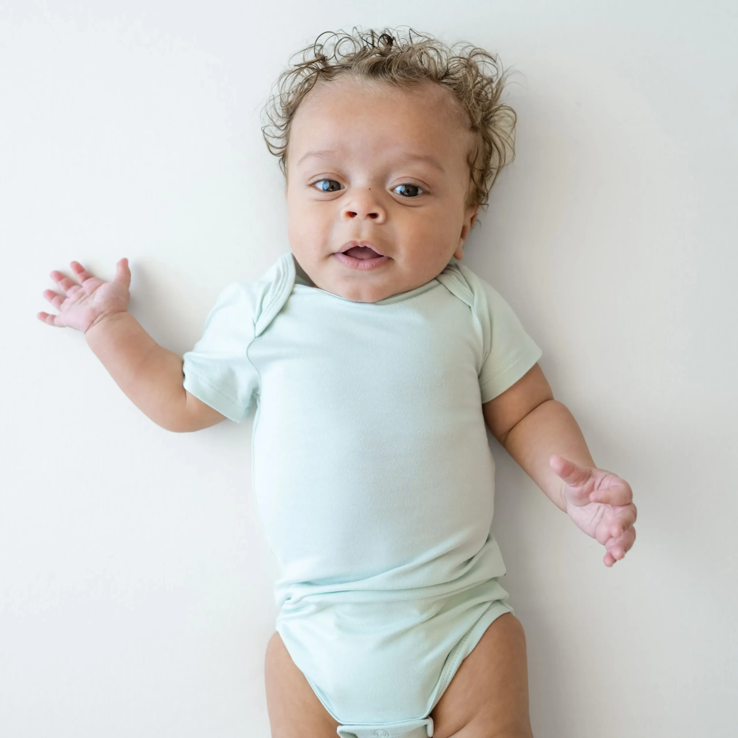 Kyte Baby Bodysuit in Dew Sale