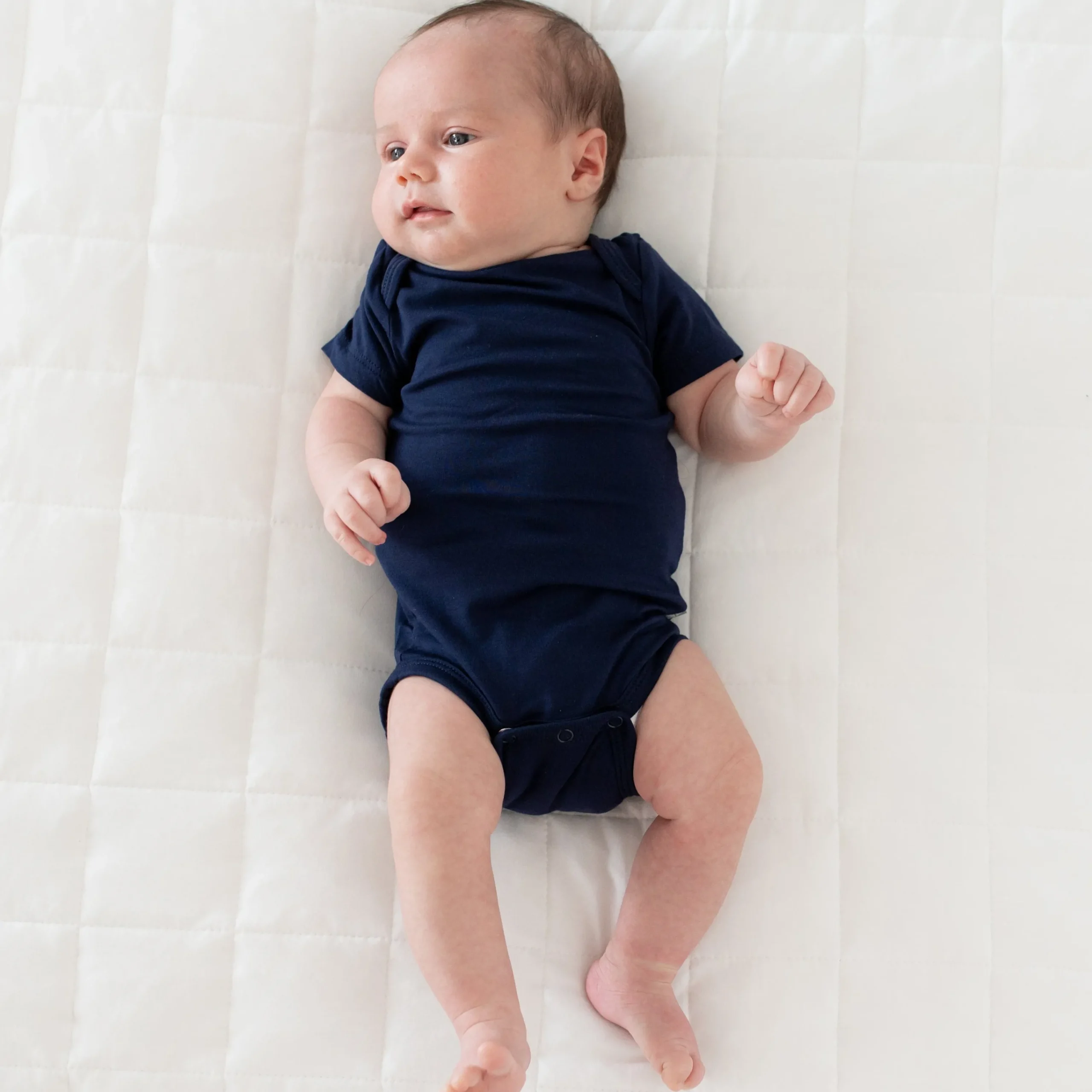 Kyte Baby Bodysuit in Navy Hot