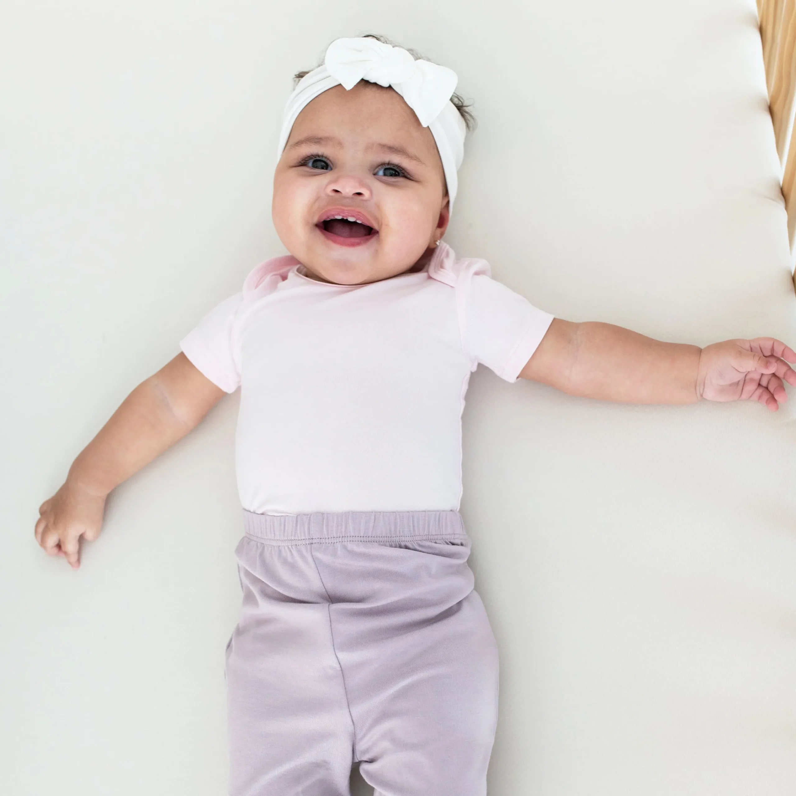 Kyte Baby Bodysuit in Sakura Best