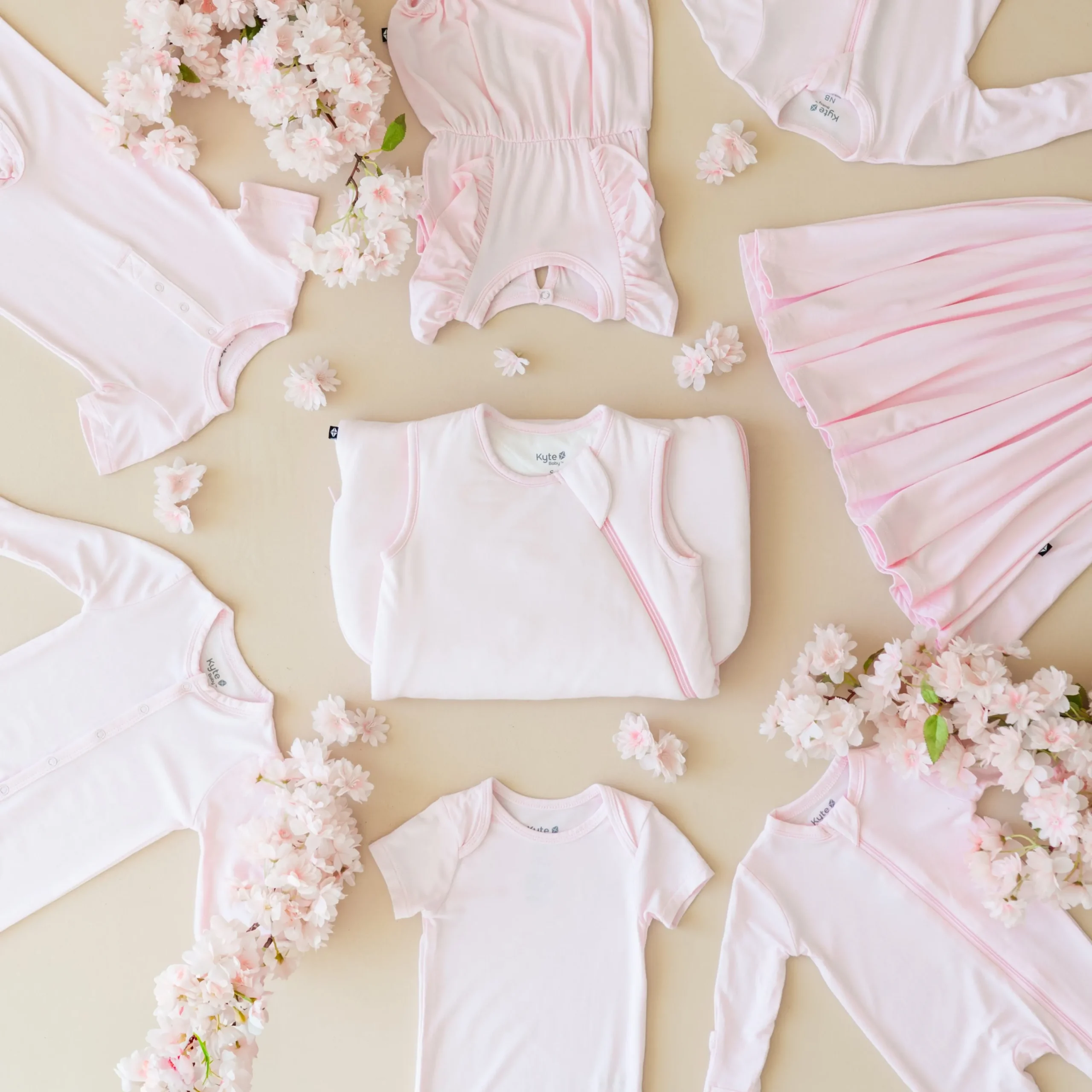Kyte Baby Bodysuit in Sakura Best