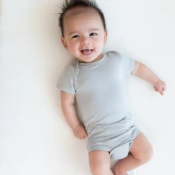 Kyte Baby Bodysuit in Storm Hot