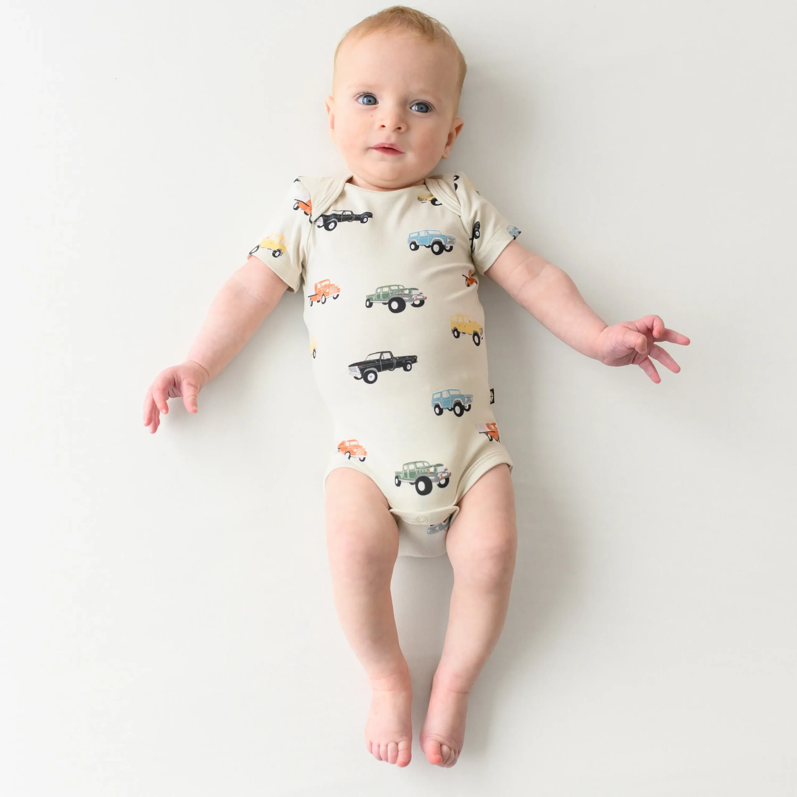 Kyte Baby Bodysuit in Vintage Truck Sale