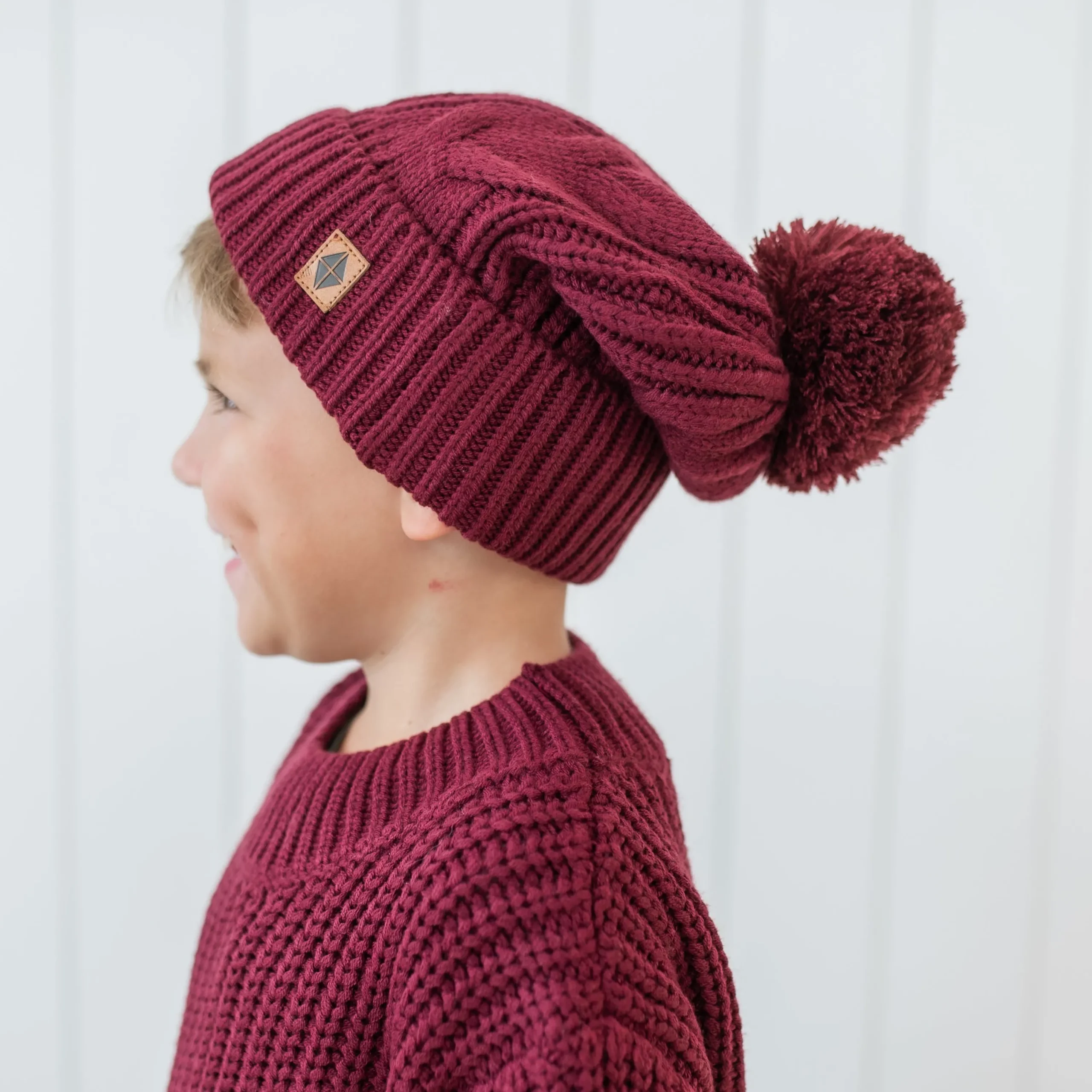 Kyte Baby Chunky Cable Knit Beanie in Burgundy Online