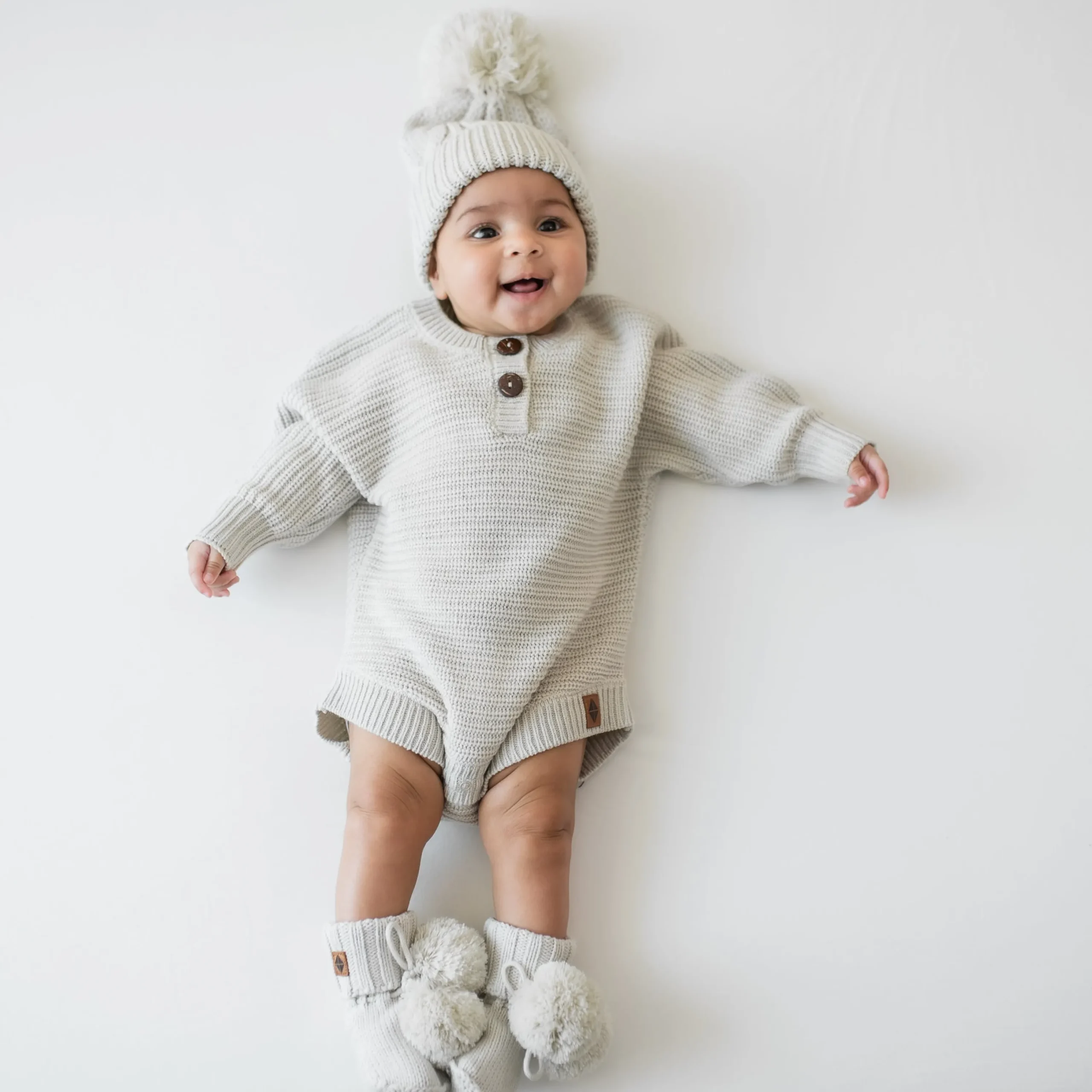Kyte Baby Chunky Knit Romper in Oat