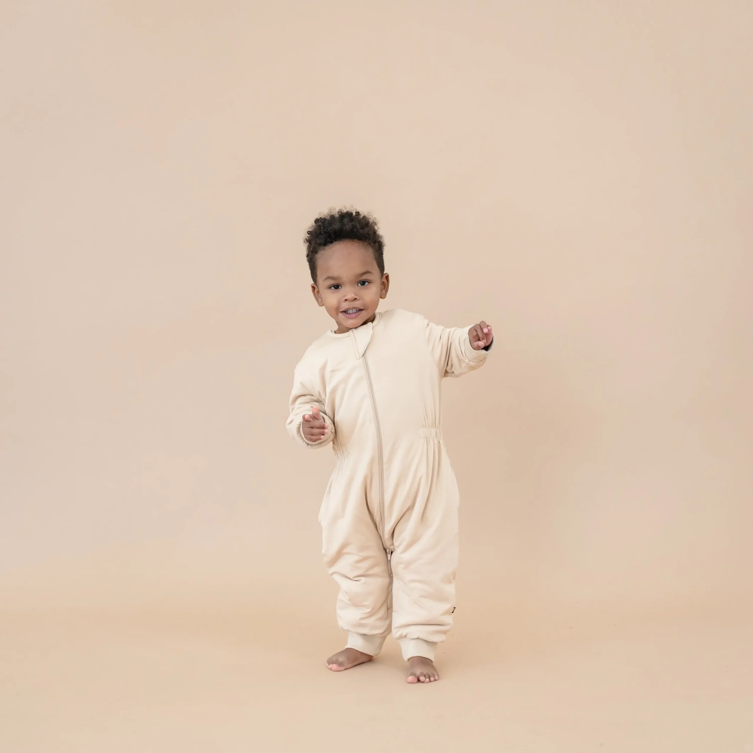 Kyte Baby Cozy Playsuit in Bisque