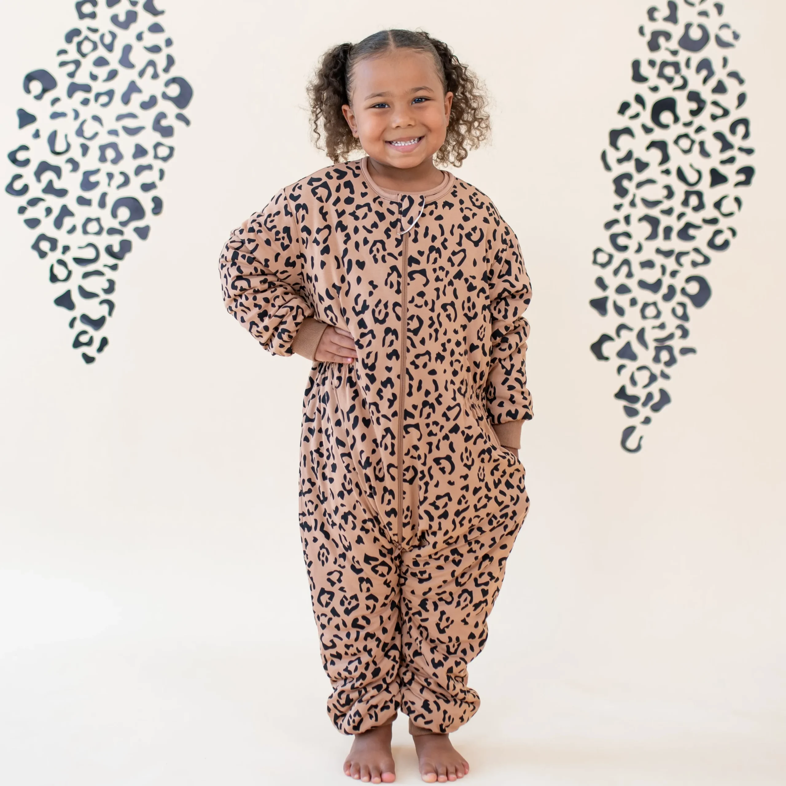Kyte Baby Cozy Playsuit in Latte Leopard Clearance