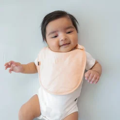 Kyte Baby Cushy Bib in Canyon Hot