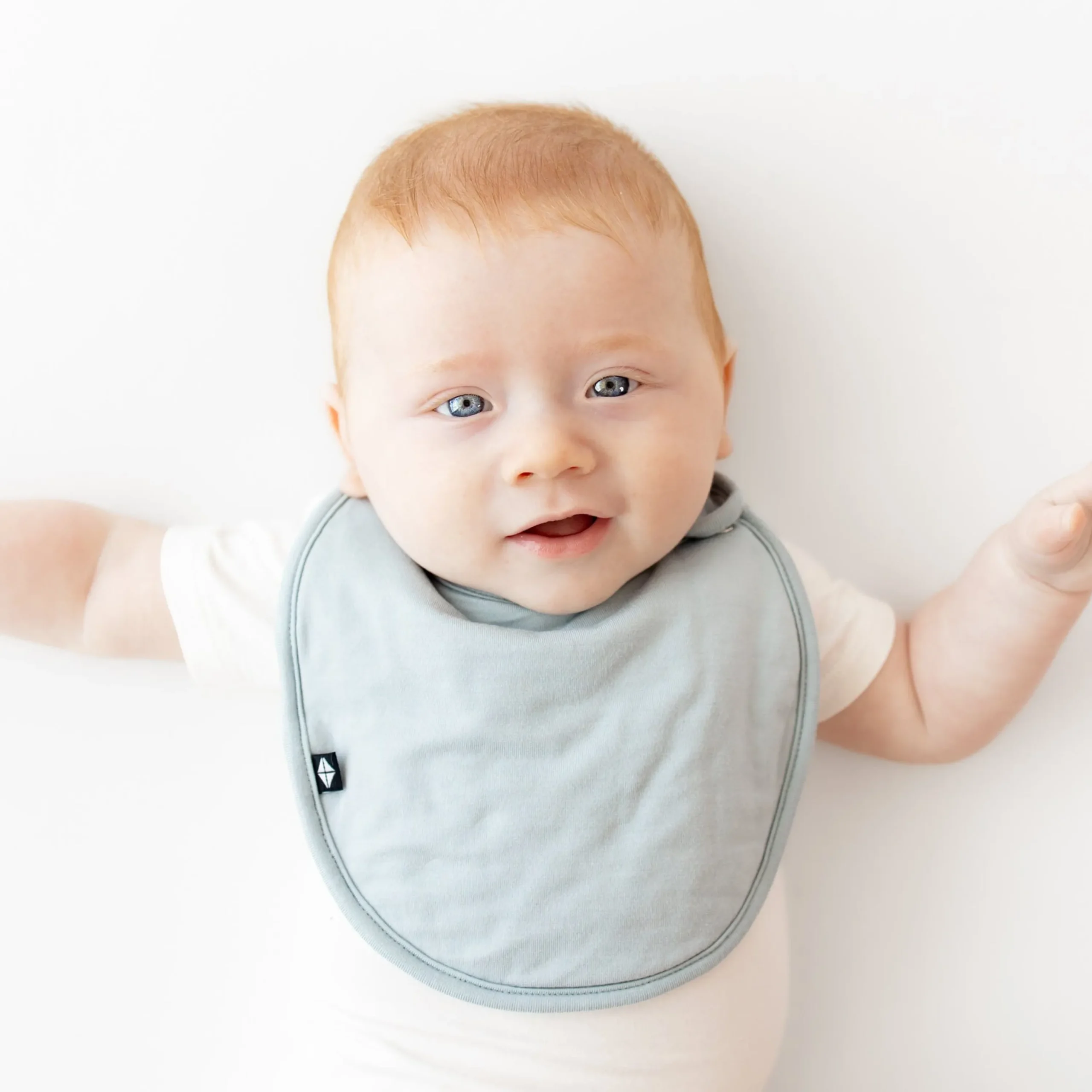 Kyte Baby Cushy Bib in Fog Clearance