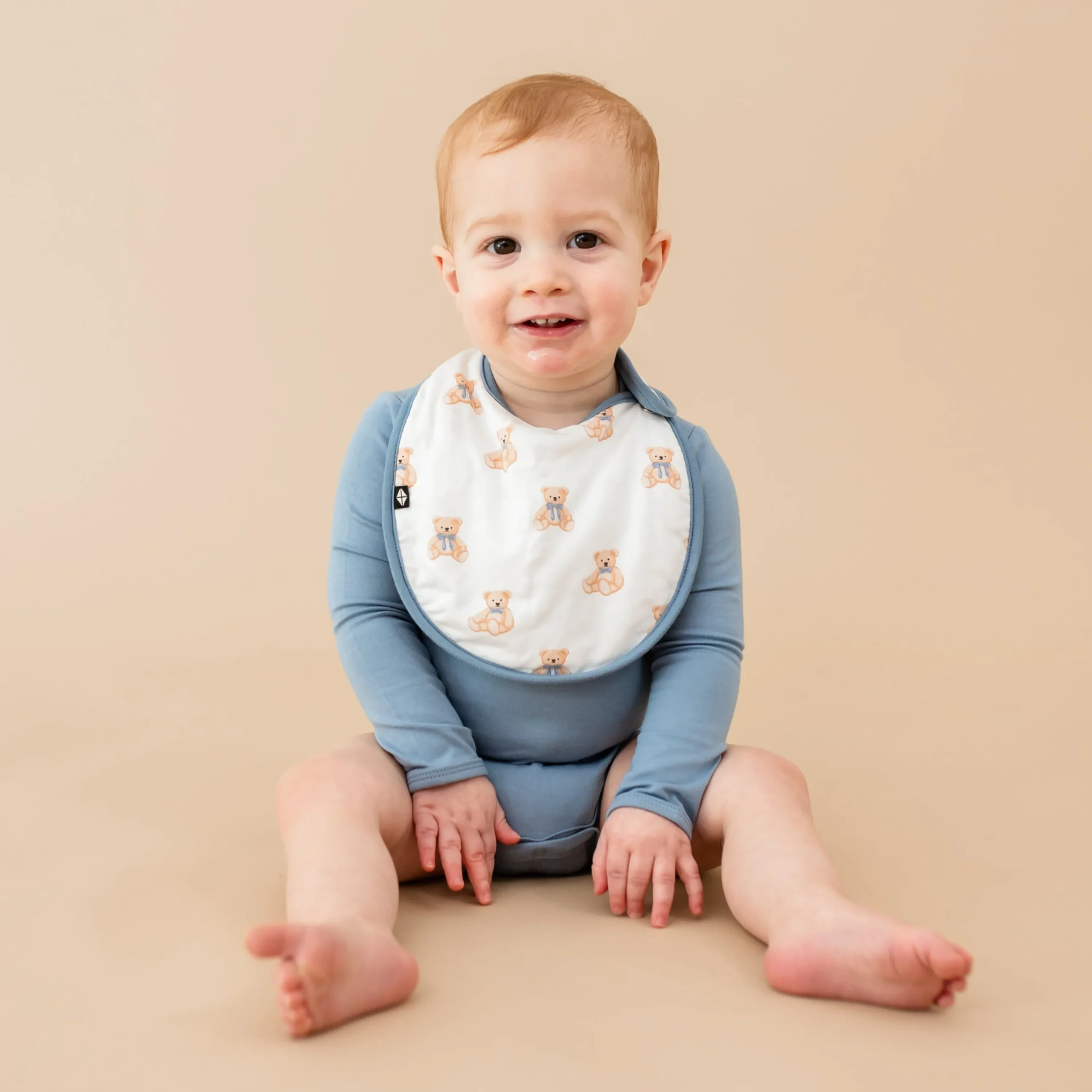 Kyte Baby Cushy Bib in Teddy Bear Hot