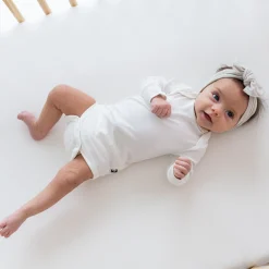 Kyte Baby Long Sleeve Bodysuit in Cloud Hot