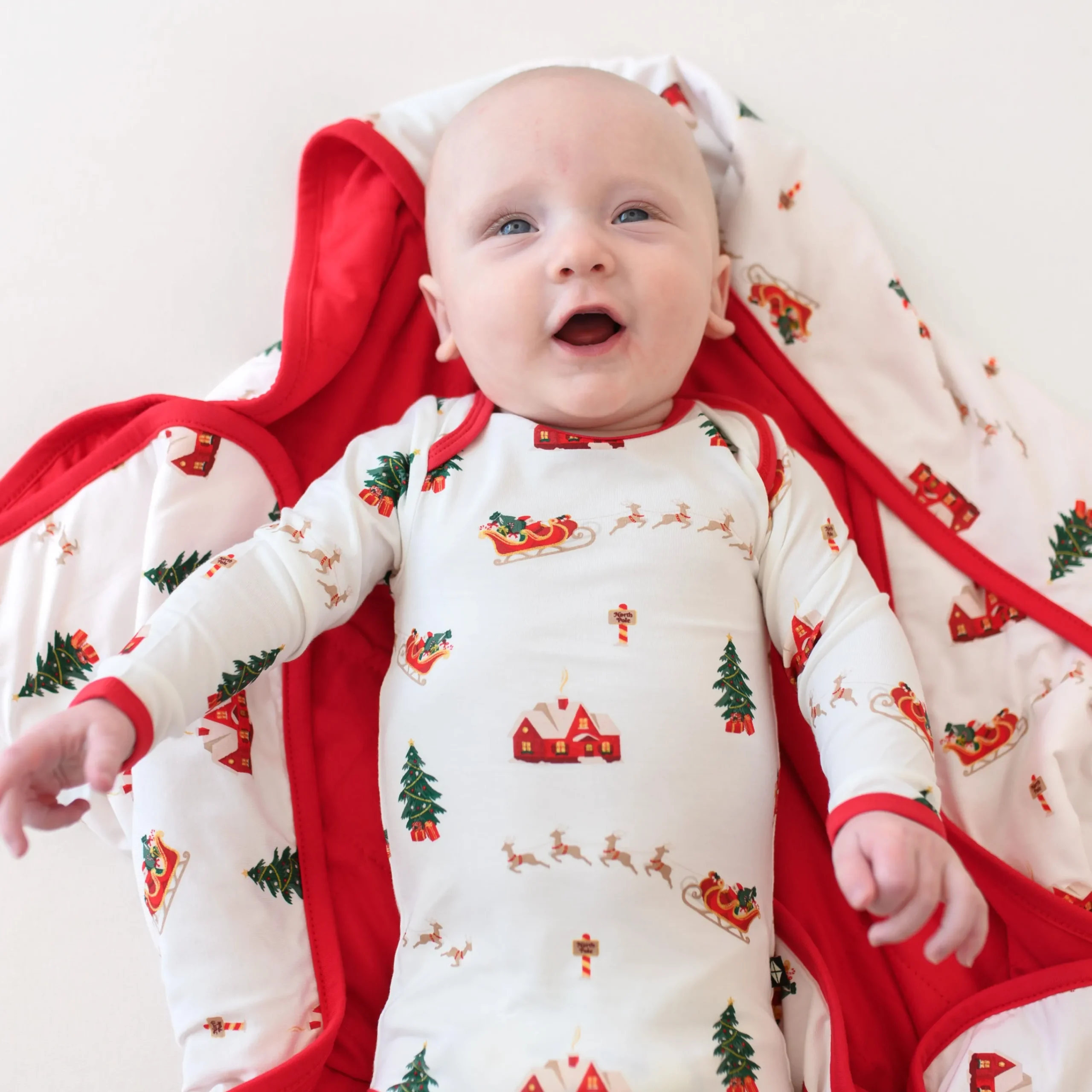 Kyte Baby Long Sleeve Bodysuit in Santa Sleigh New