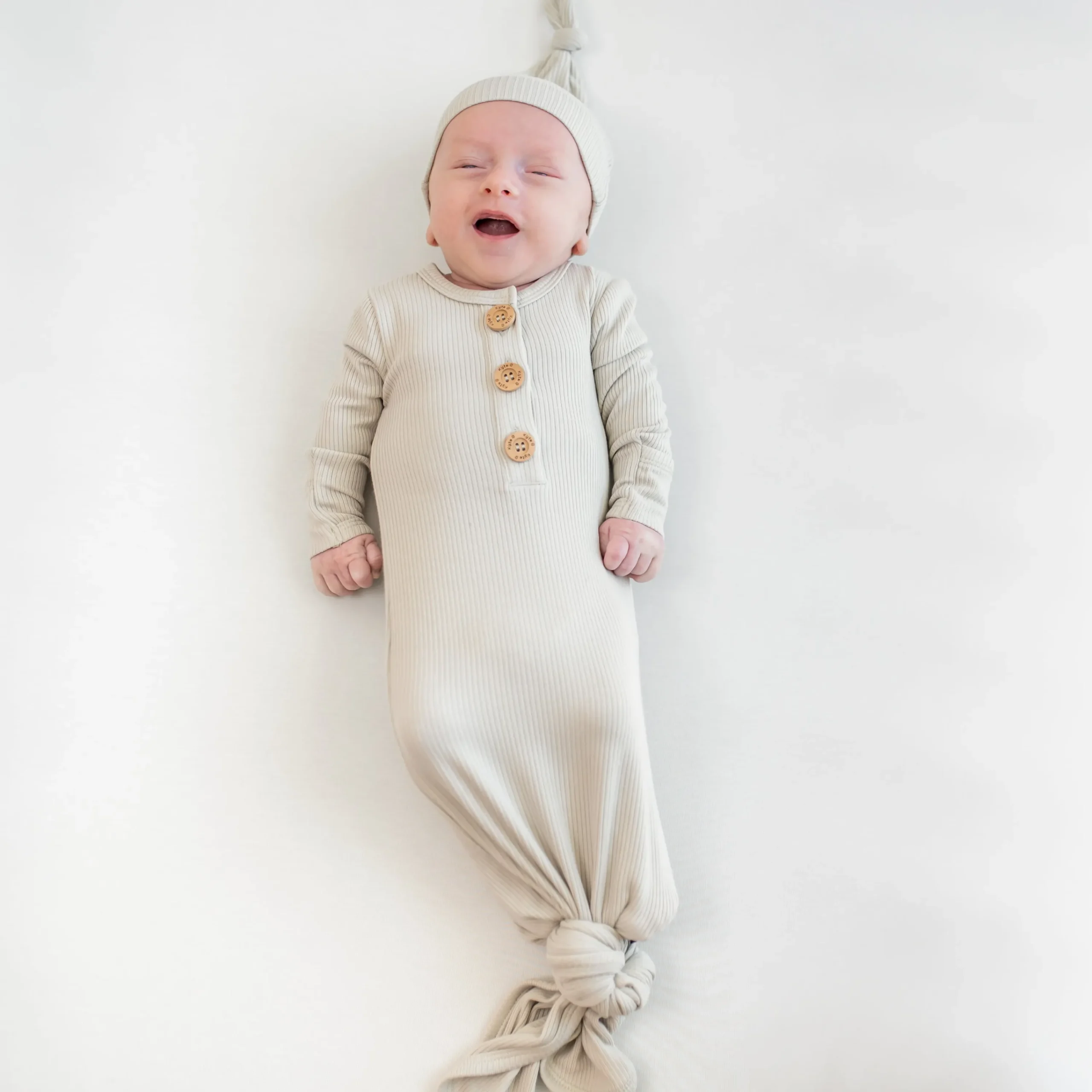 Kyte Baby Ribbed Knotted Gown with Hat Set in Oat Best
