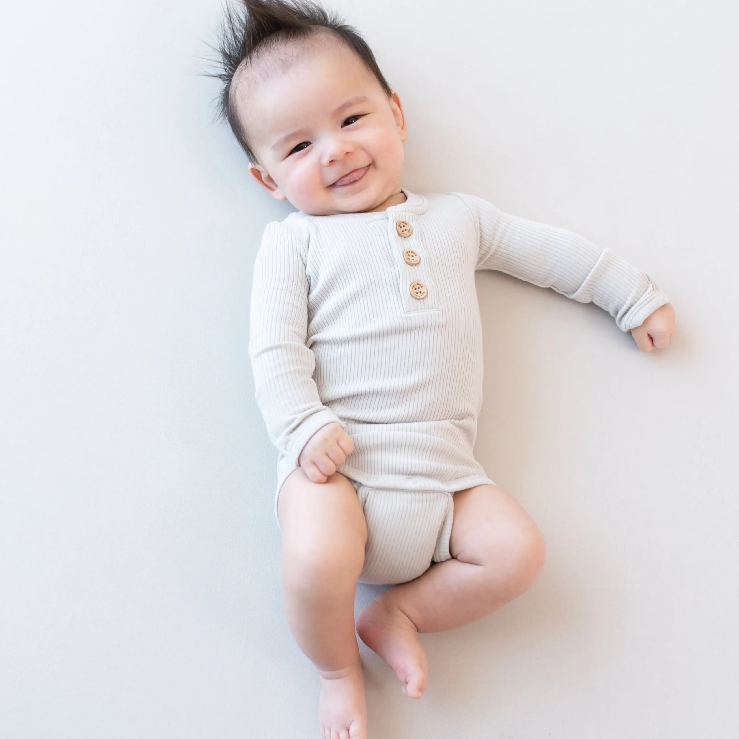 Kyte Baby Ribbed Long Sleeve Henley Bodysuit in Oat Online