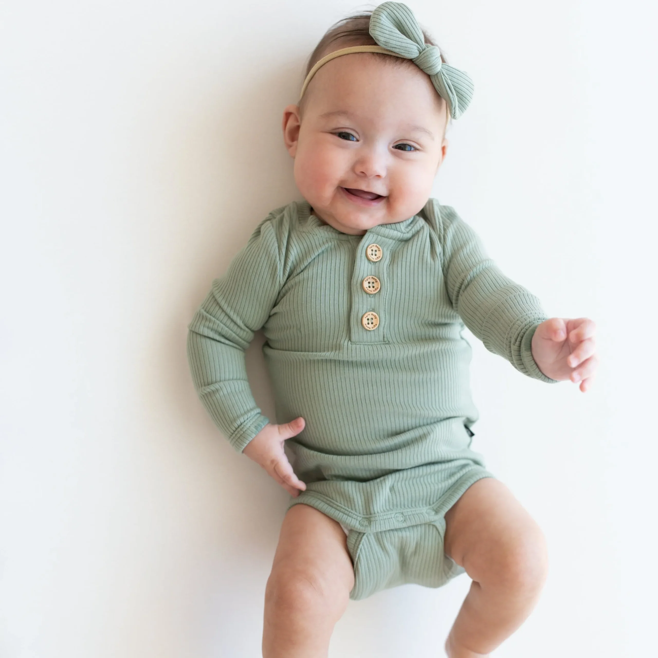 Kyte Baby Ribbed Long Sleeve Henley Bodysuit in Thyme Sale