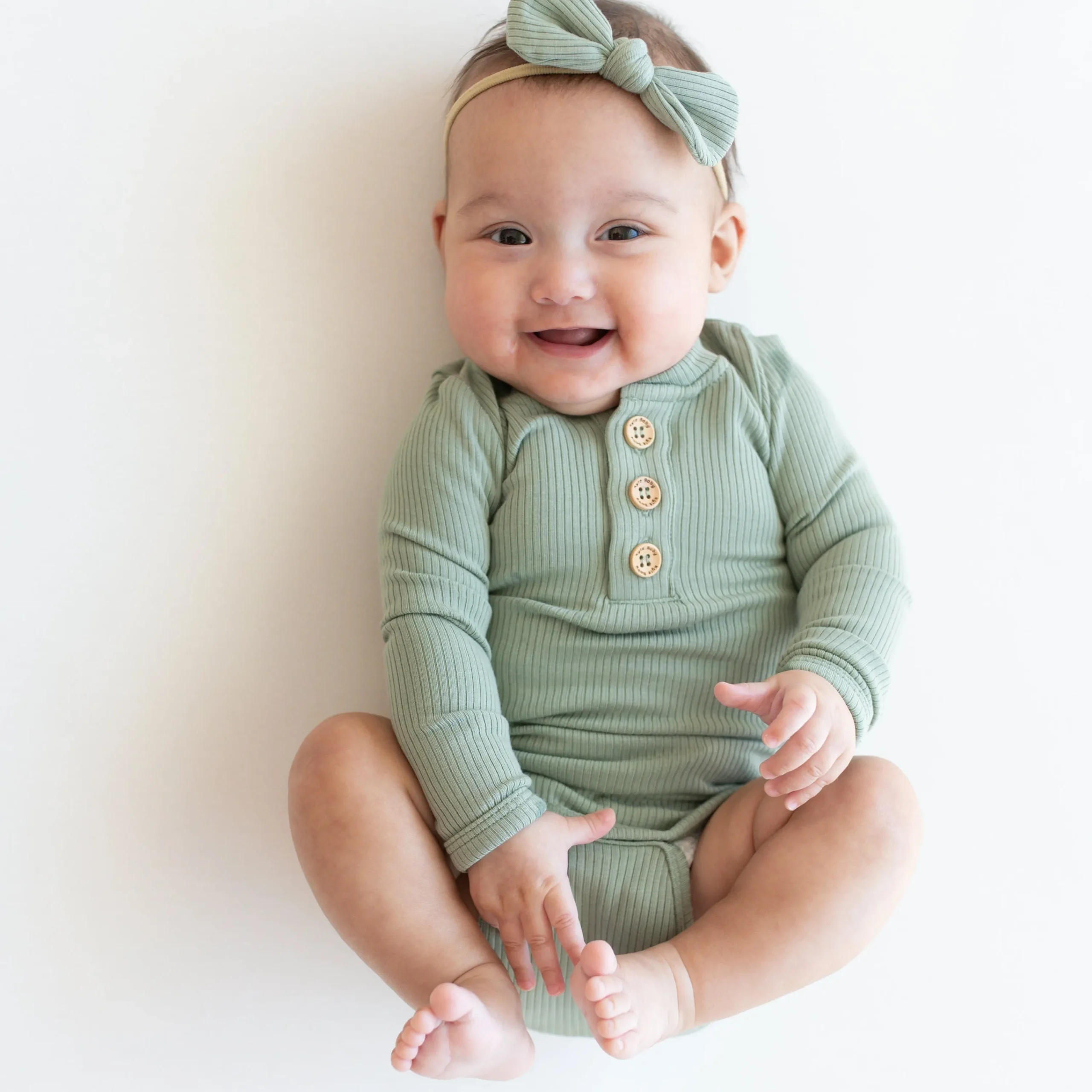 Kyte Baby Ribbed Long Sleeve Henley Bodysuit in Thyme Sale