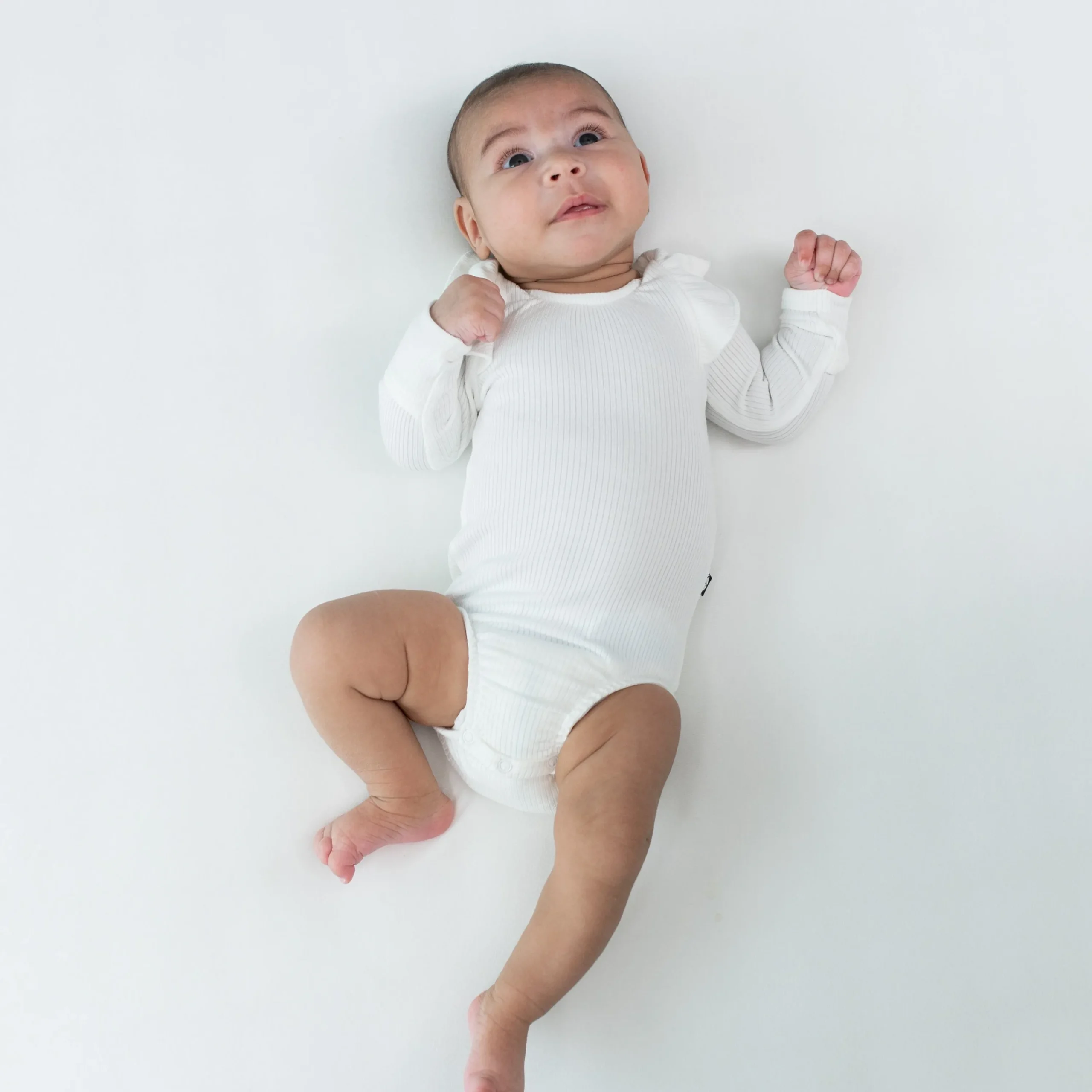 Kyte Baby Ribbed Long Sleeve Ruffle Leotard in Cloud
