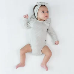 Kyte Baby Ribbed Long Sleeve Ruffle Leotard in Oat
