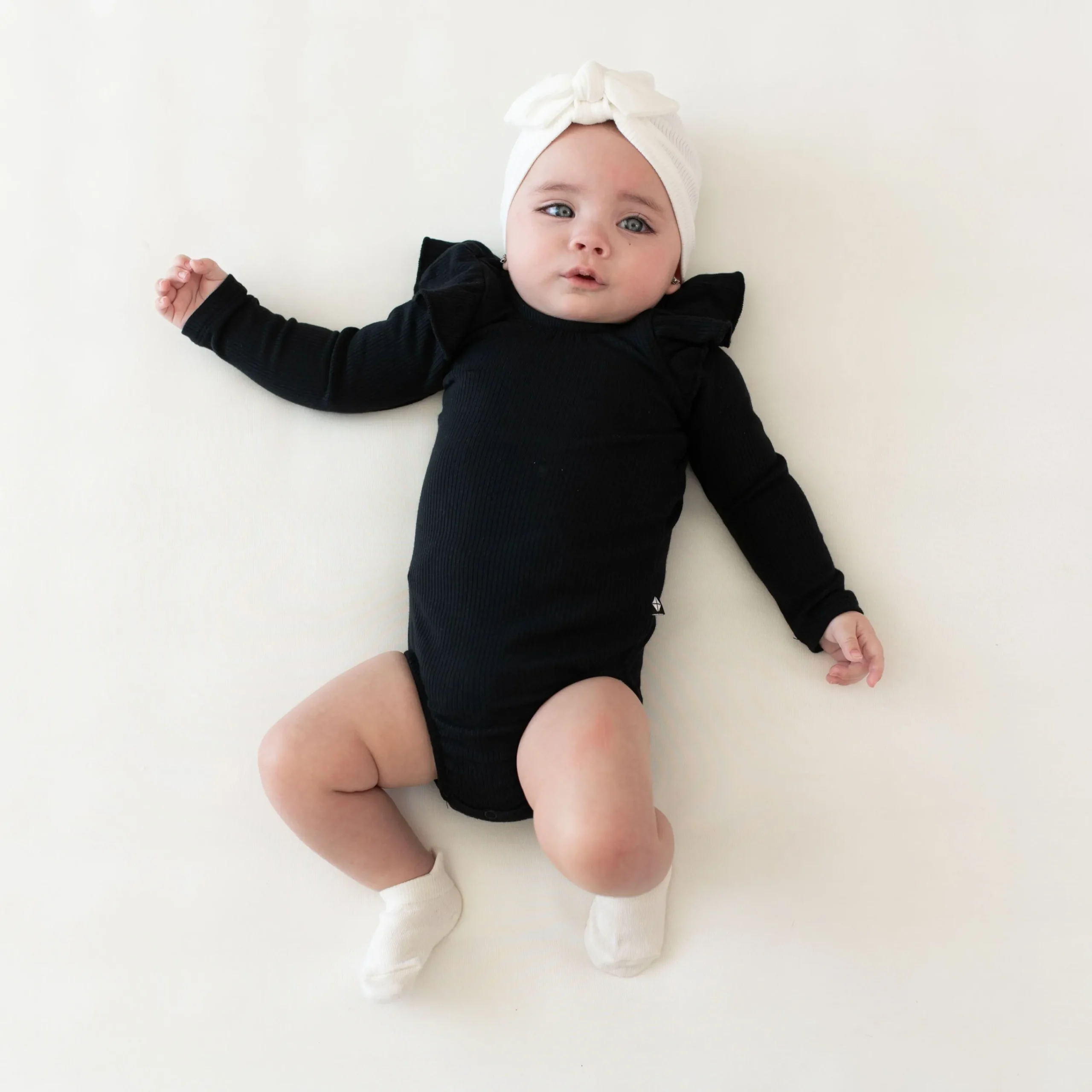 Kyte Baby Ribbed Long Sleeve Ruffle Leotard in Midnight Best