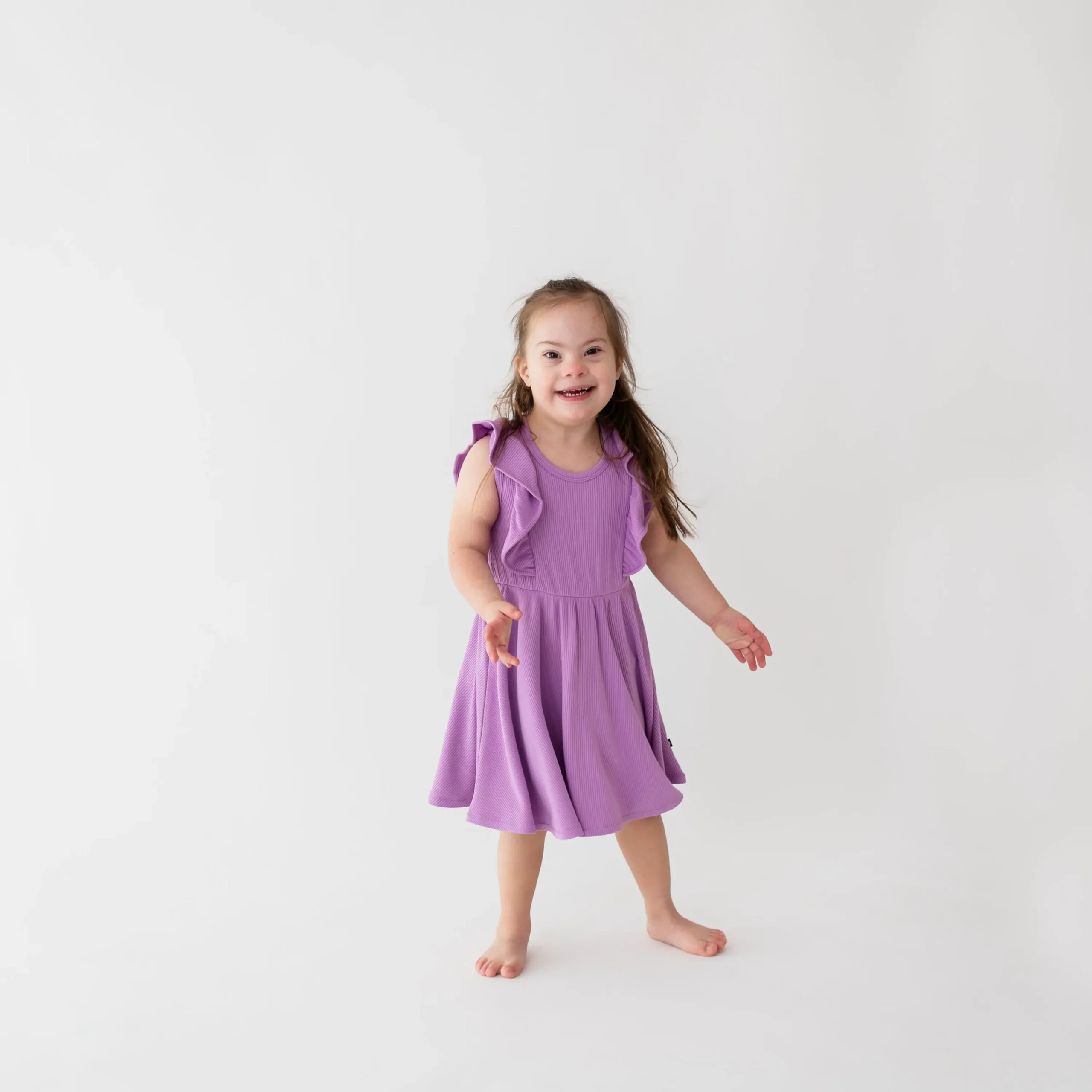 Kyte Baby Ribbed Peplum Dress Set in Poi