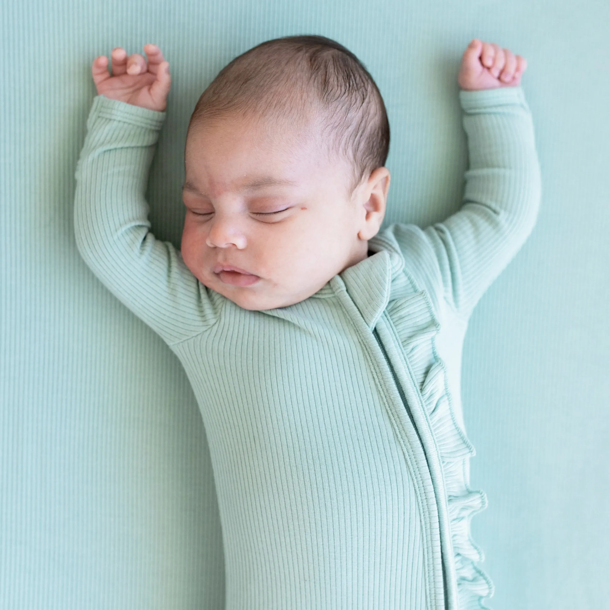 Kyte Baby Ribbed Ruffle Zipper Footie in Sage Clearance