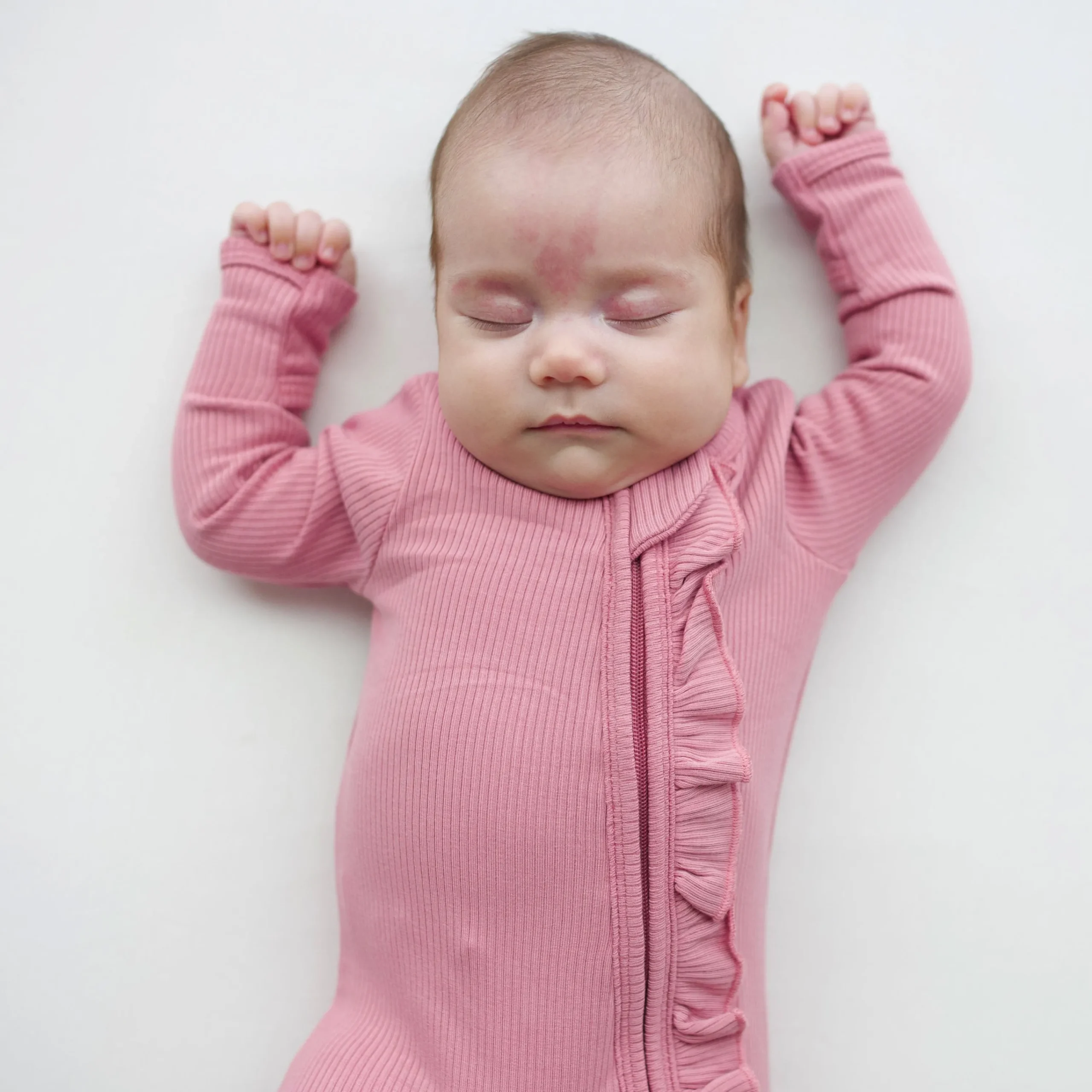 Kyte Baby Ribbed Ruffle Zipper Romper in Apple Blossom Online
