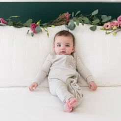 Kyte Baby Ribbed Ruffle Zipper Romper in Oat Clearance