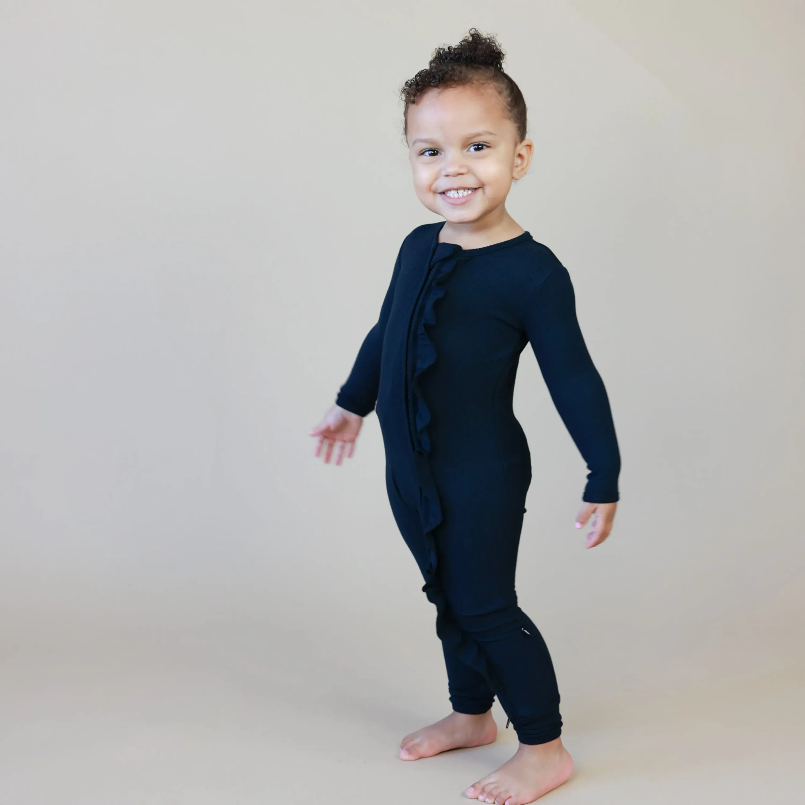 Kyte Baby Ribbed Ruffle Zipper Romper in Midnight