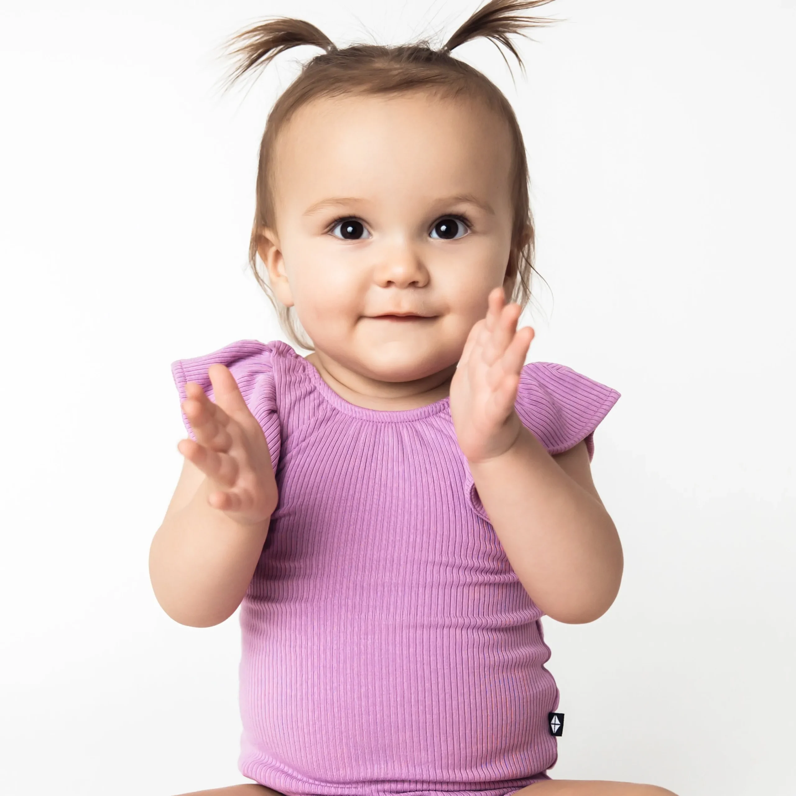 Kyte Baby Ribbed Sleeveless Ruffle Leotard in Poi