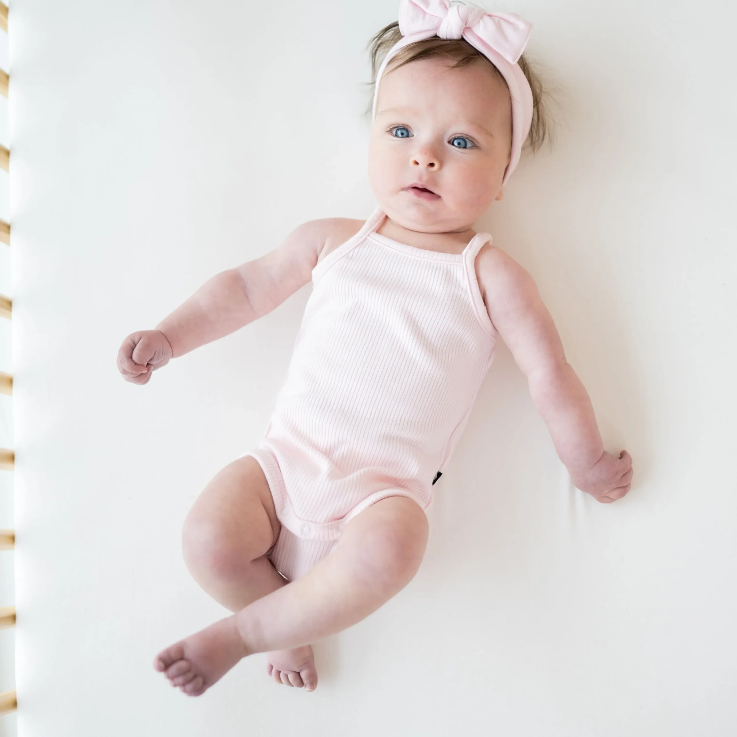 Kyte Baby Ribbed Spaghetti Strap Bodysuit in Sakura Online