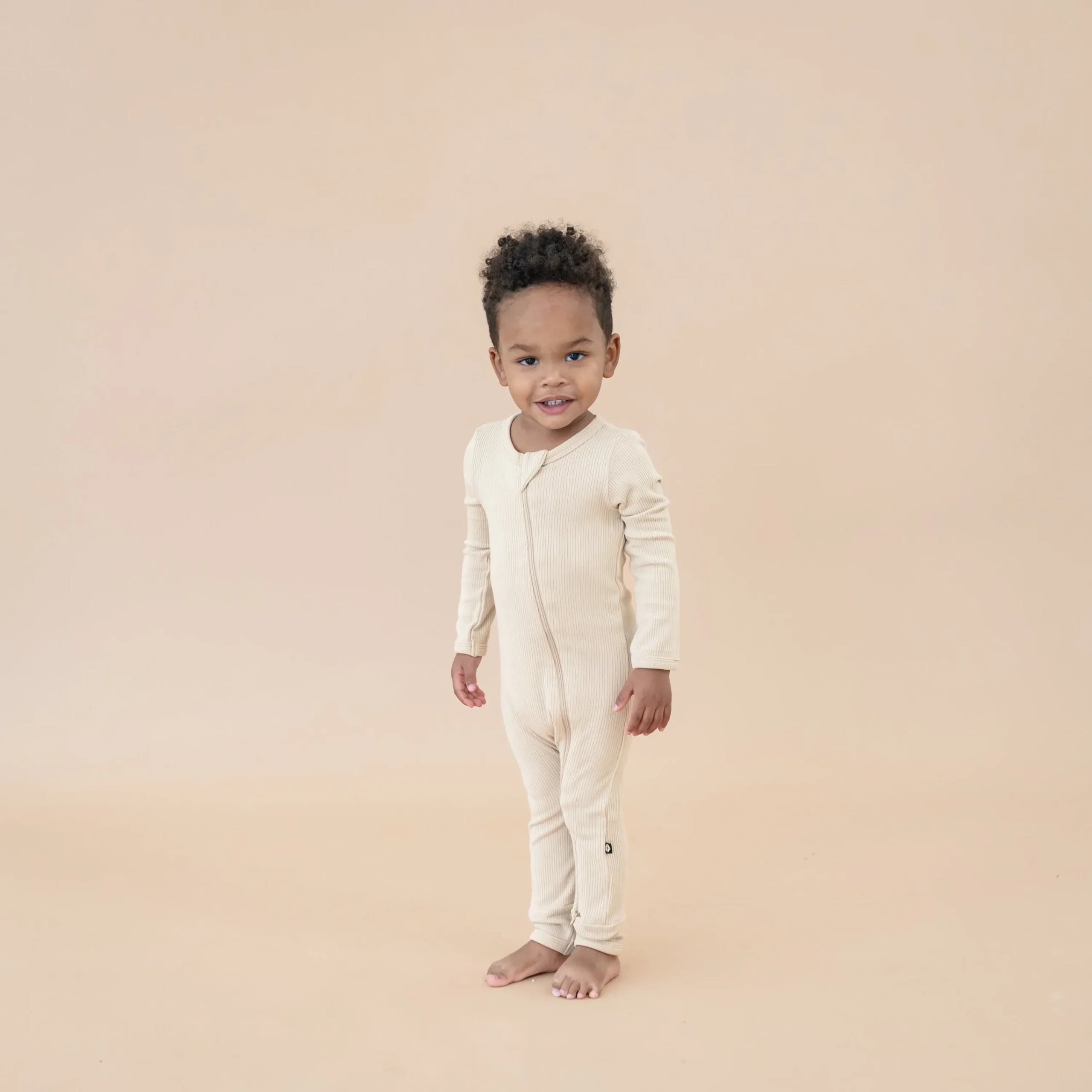 Kyte Baby Ribbed Zipper Romper in Bisque New