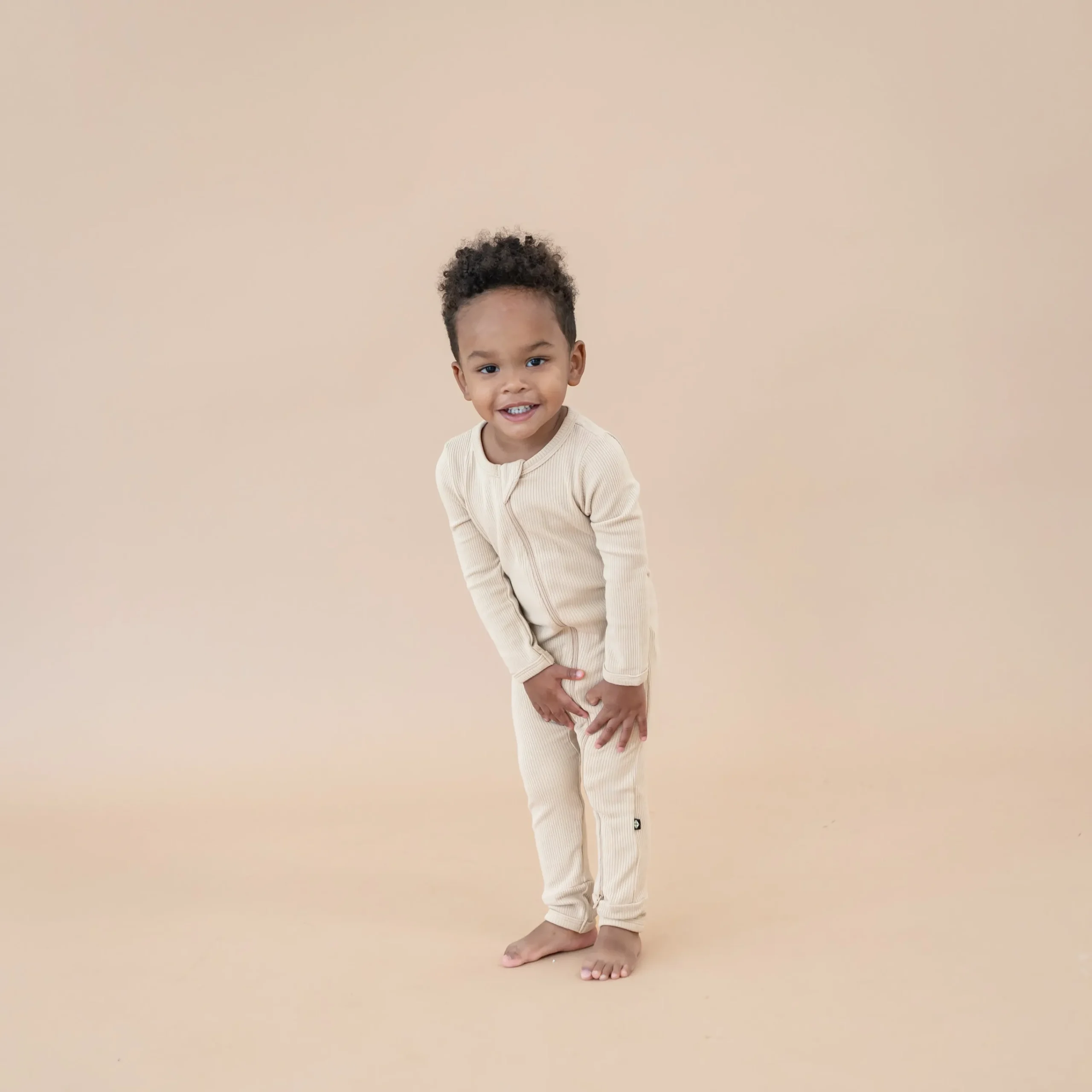 Kyte Baby Ribbed Zipper Romper in Bisque New