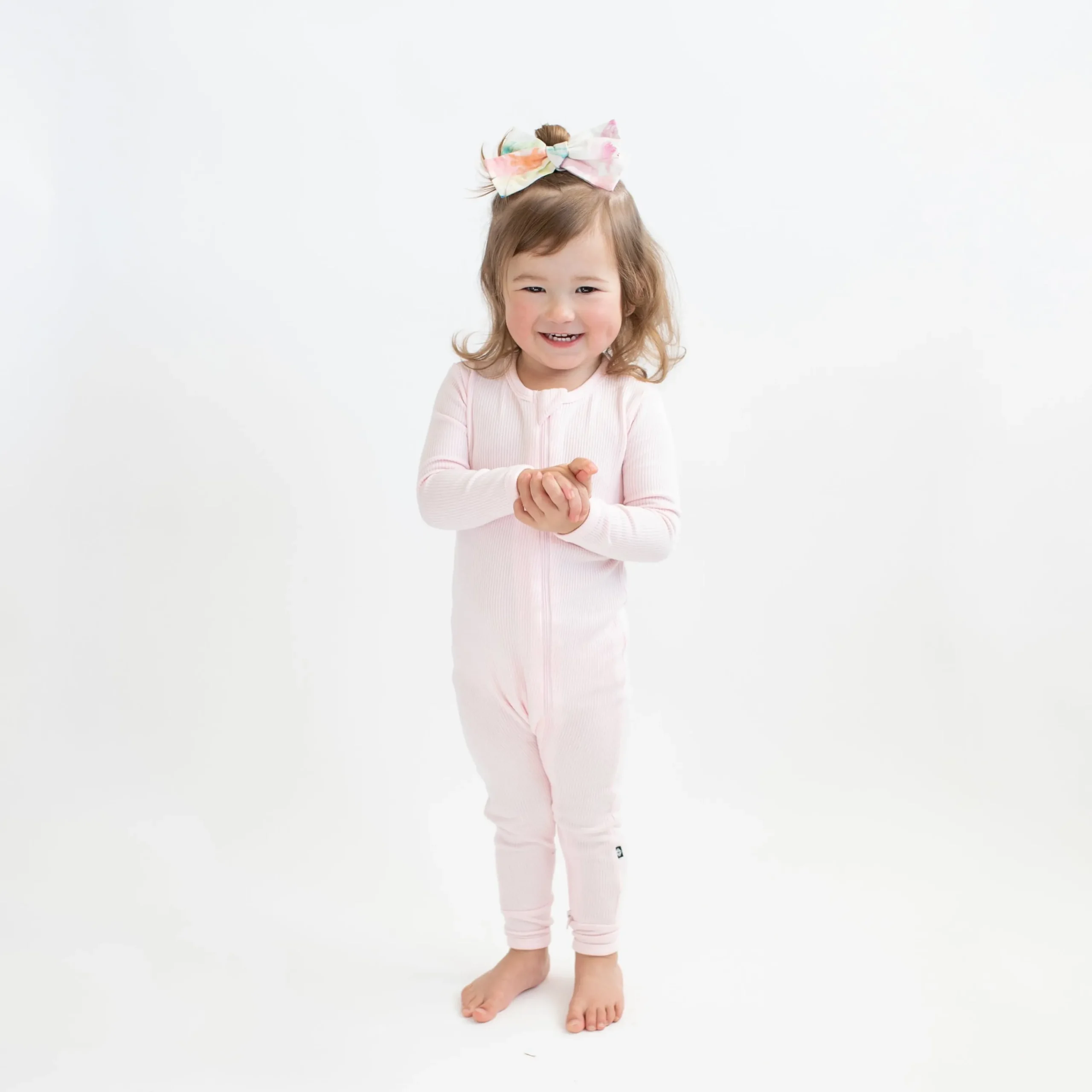 Kyte Baby Ribbed Zipper Romper in Sakura Hot
