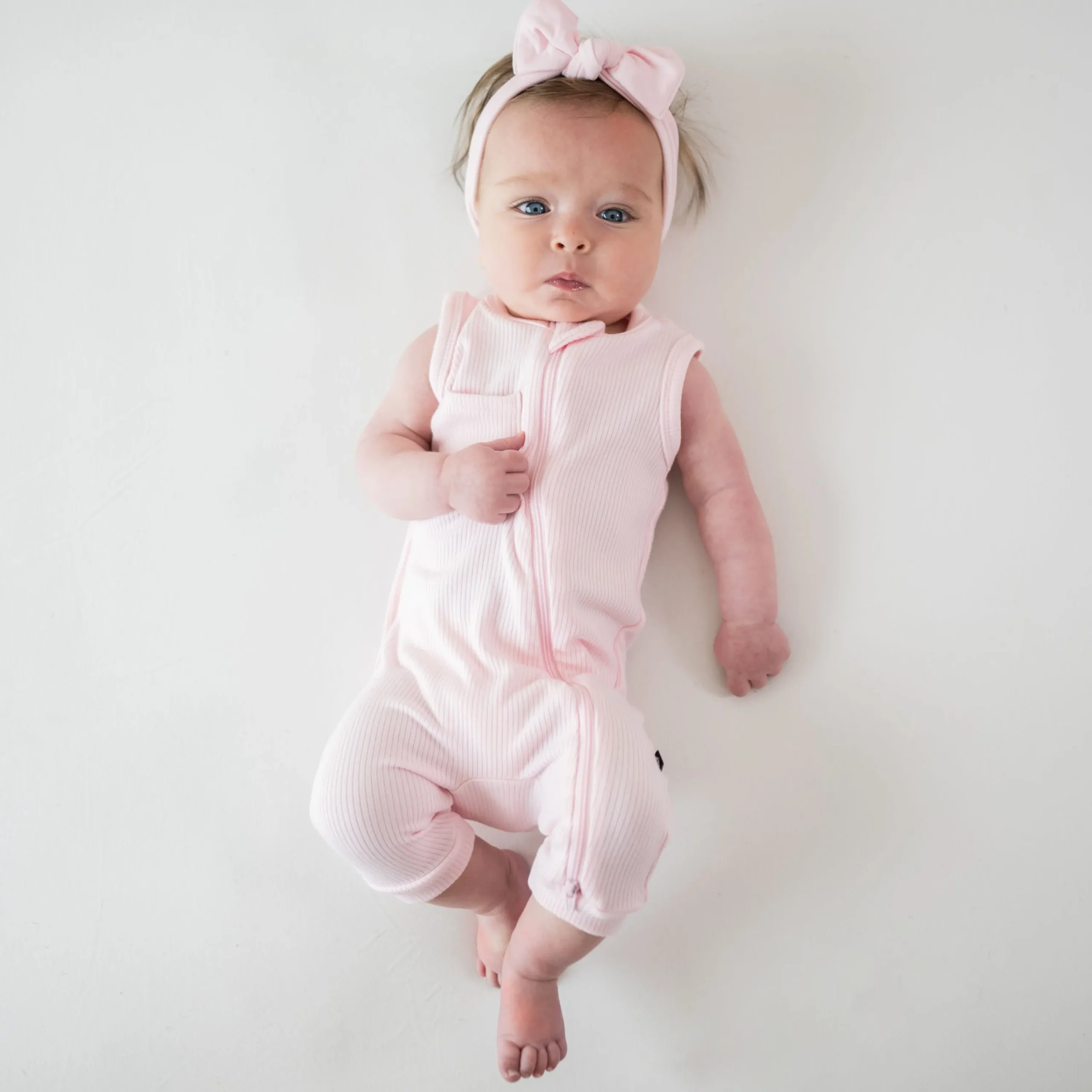 Kyte Baby Ribbed Zippered Sleeveless Romper in Sakura Discount