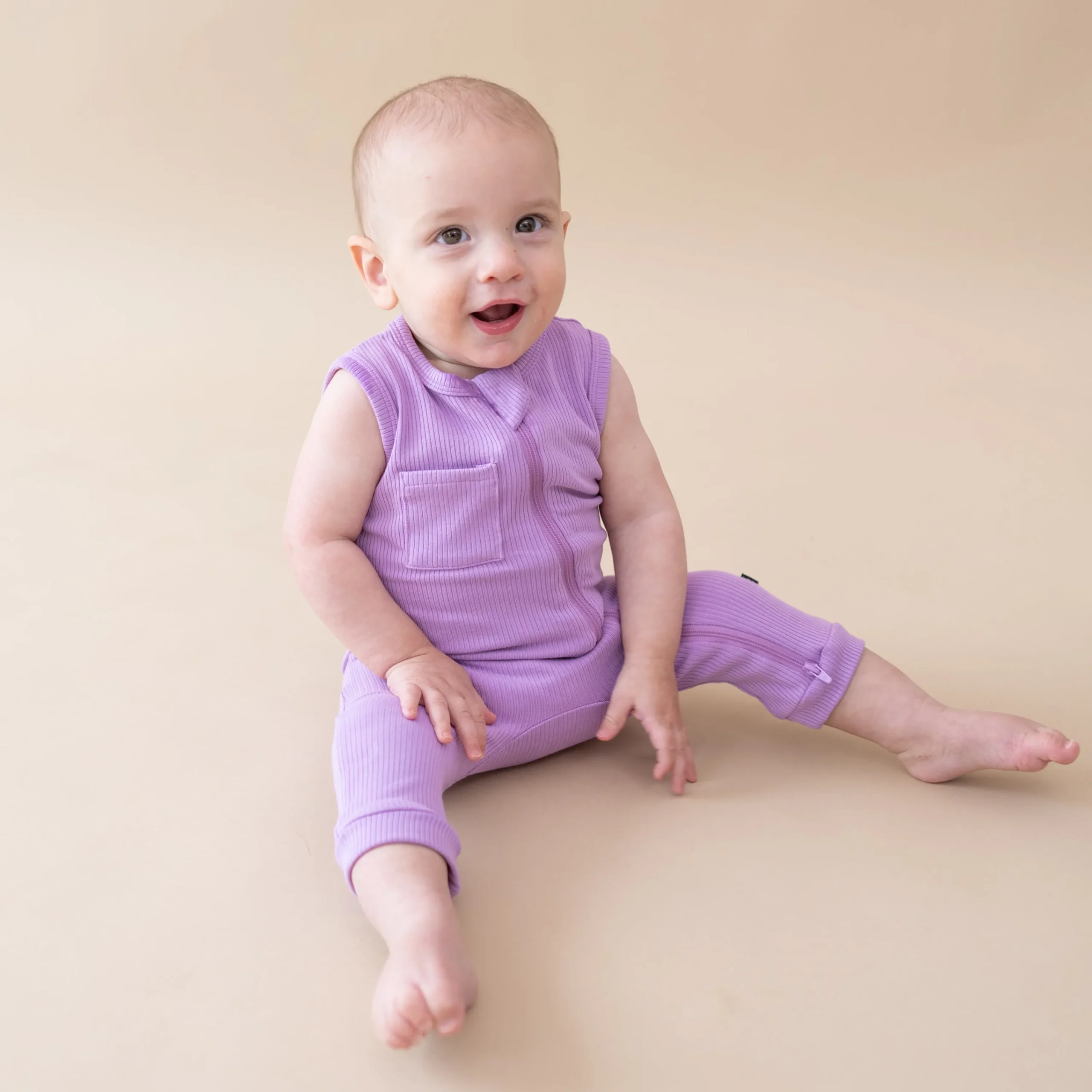 Kyte Baby Ribbed Zippered Sleeveless Romper in Poi New