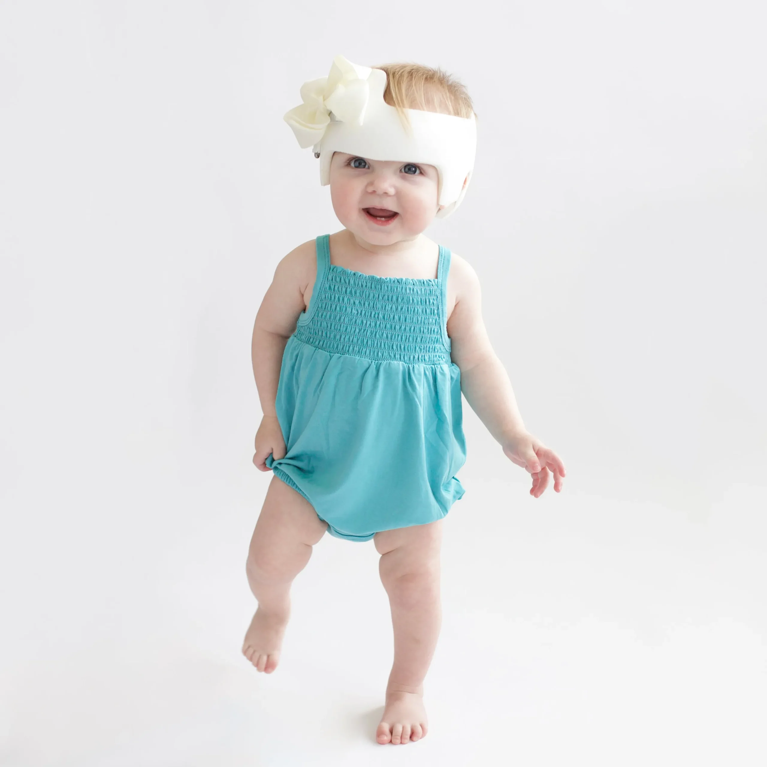 Kyte Baby Smocked Bubble Romper in Makai Best