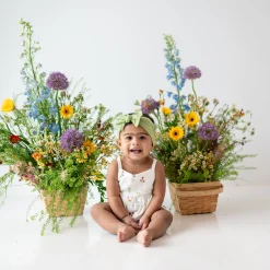 Kyte Baby Smocked Bubble Romper in Wildflower Discount