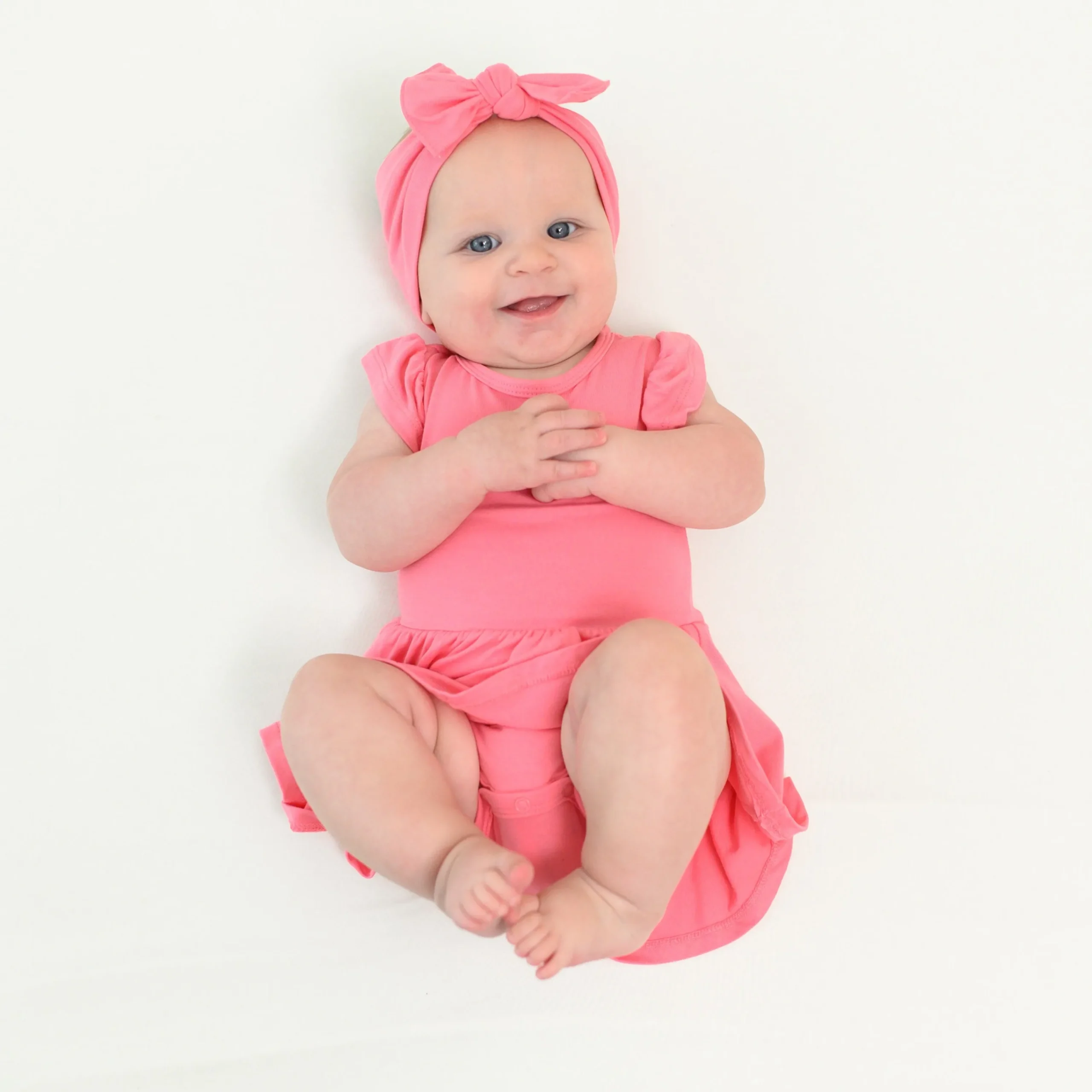 Kyte Baby Twirl Bodysuit Dress in Guava Clearance