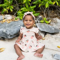 Kyte Baby Twirl Bodysuit Dress in Peach