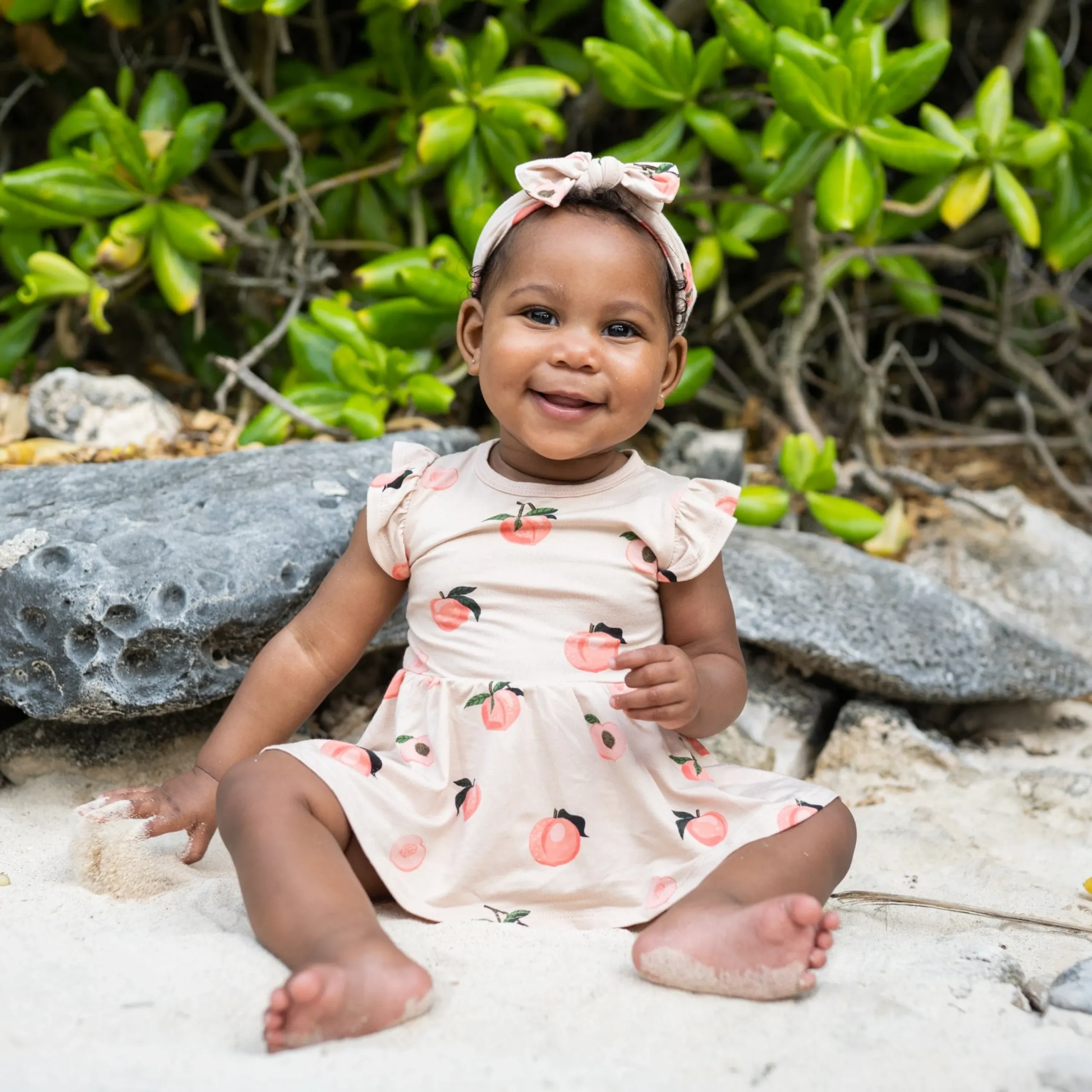 Kyte Baby Twirl Bodysuit Dress in Peach