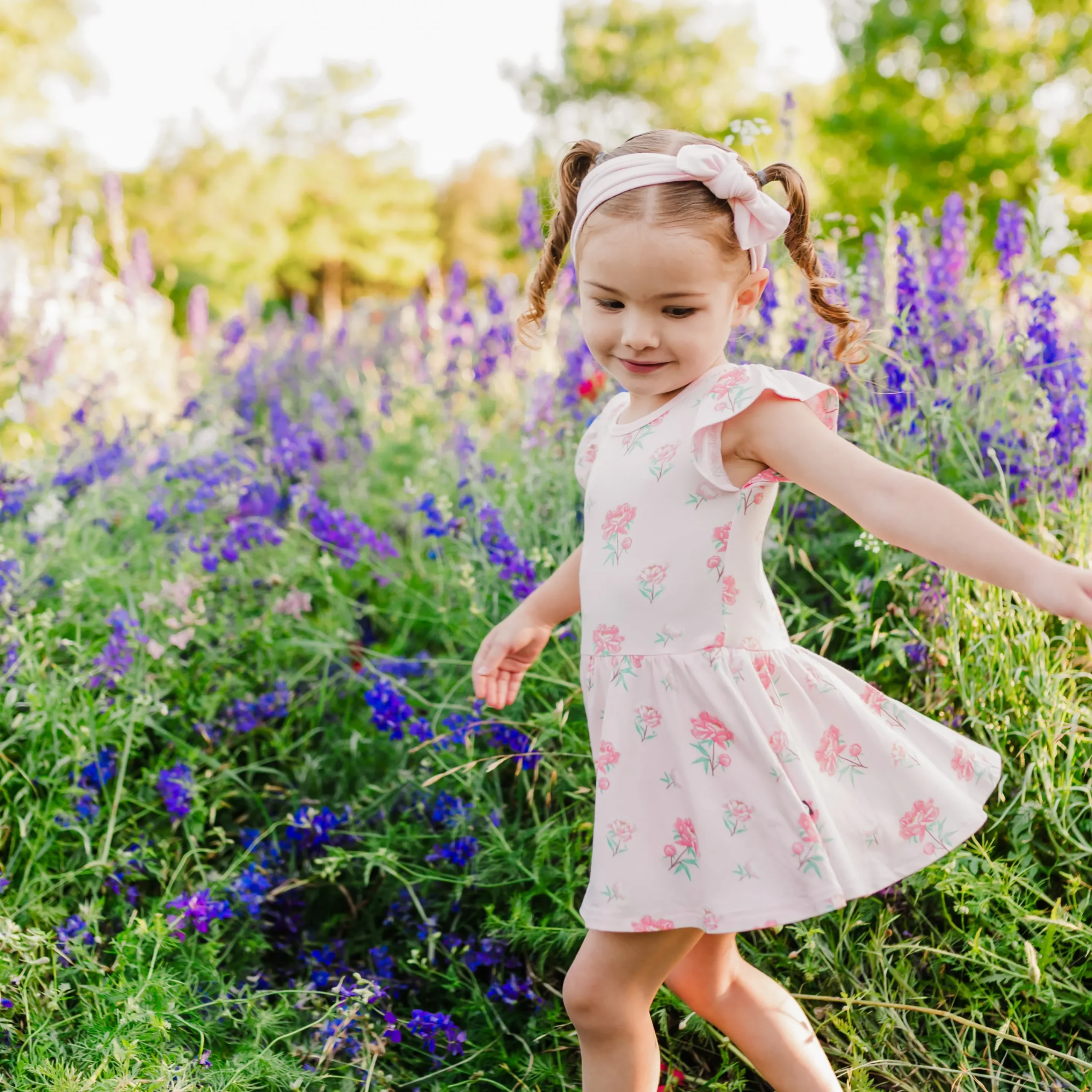 Kyte Baby Twirl Bodysuit Dress in Sakura Peony Best