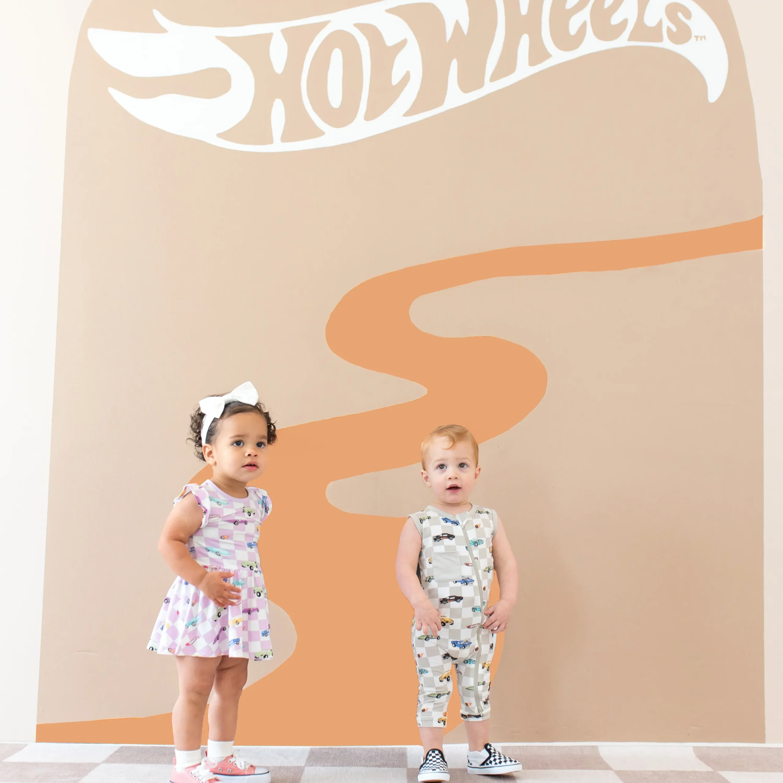 Kyte Baby Twirl Bodysuit Dress in Sparkles and Speed Best