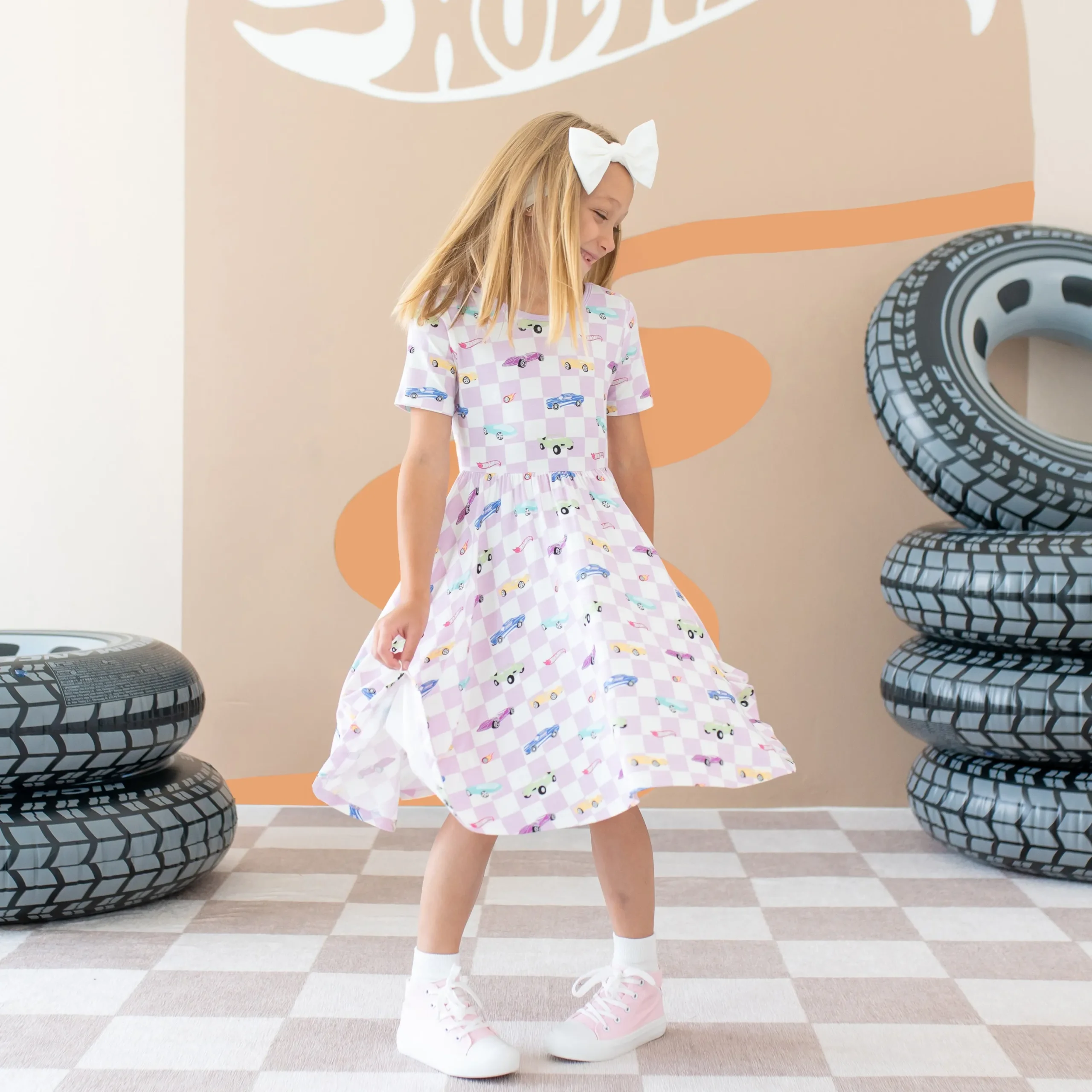 Kyte Baby Twirl Dress in Sparkles and Speed Hot