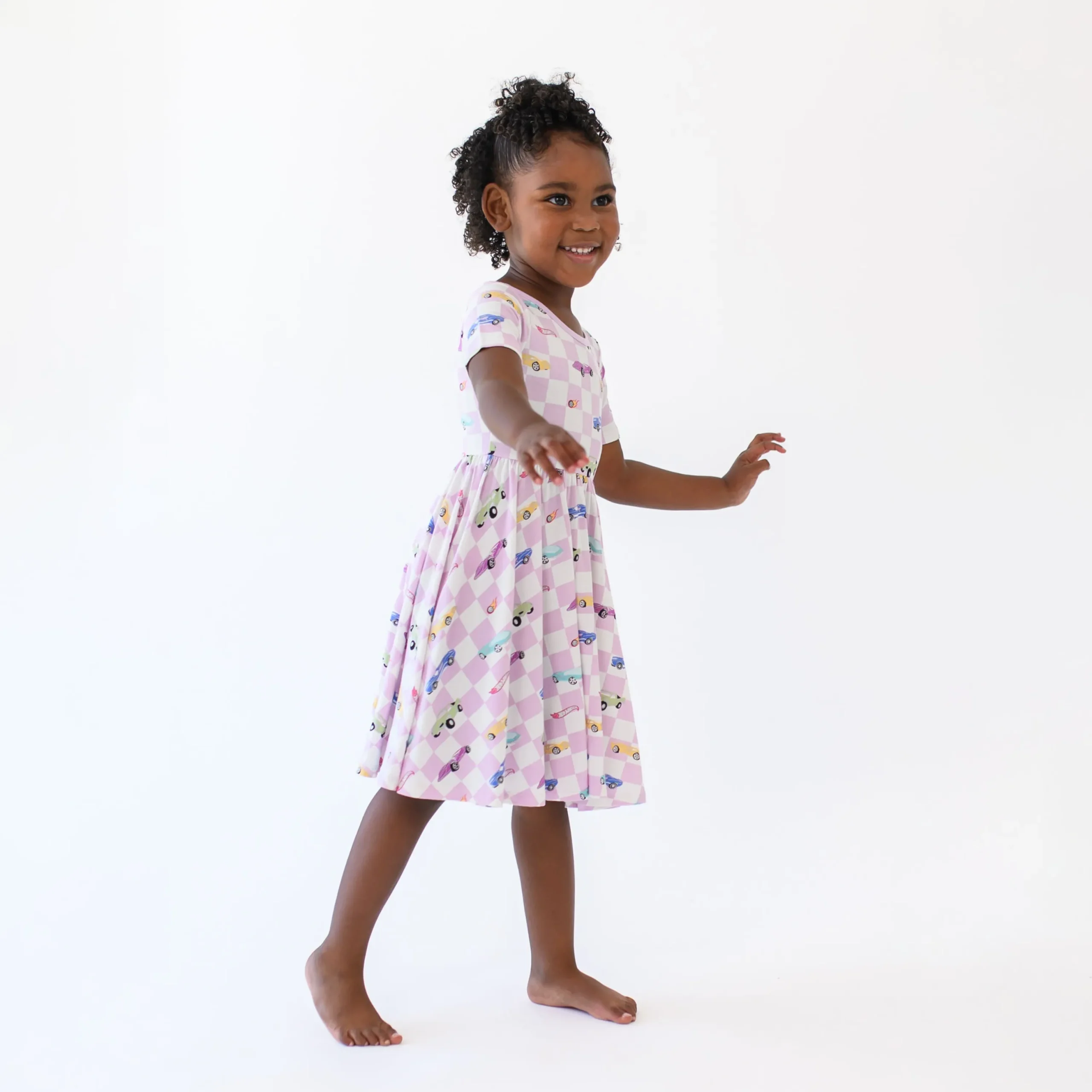Kyte Baby Twirl Dress in Sparkles and Speed Hot