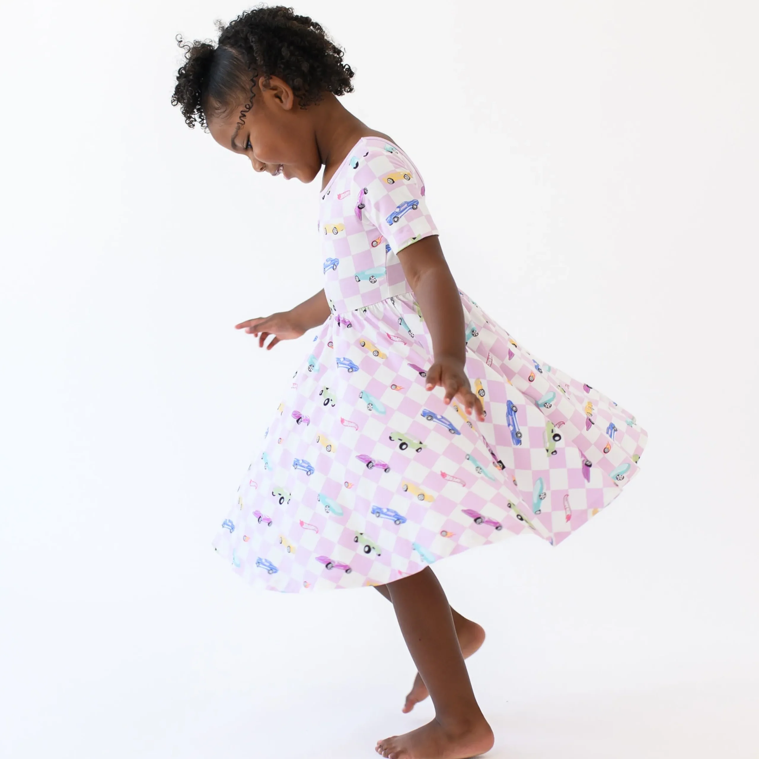 Kyte Baby Twirl Dress in Sparkles and Speed Hot