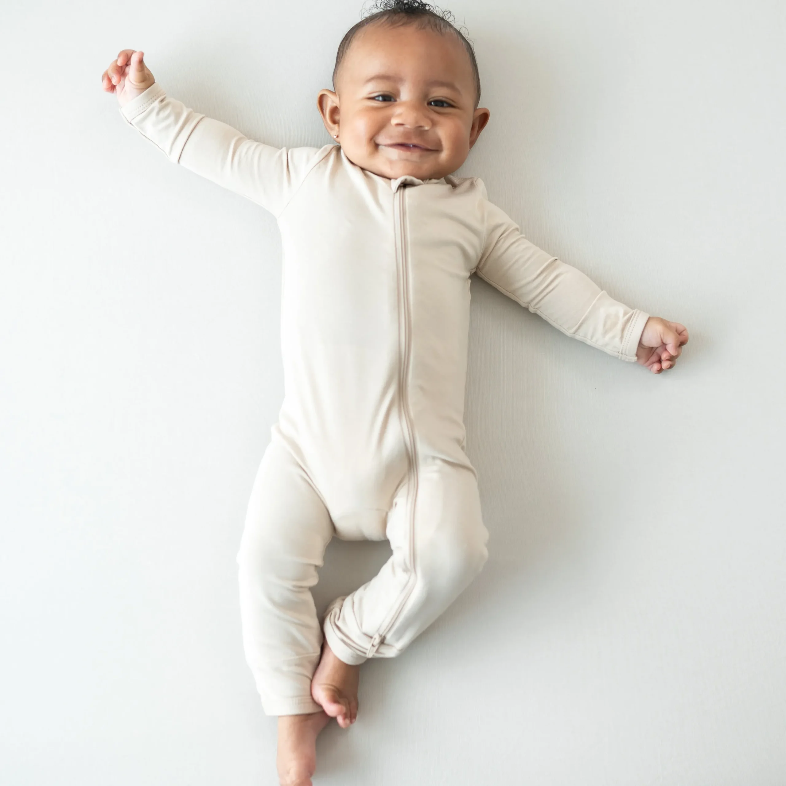 Kyte Baby Zippered Romper in Bisque Hot