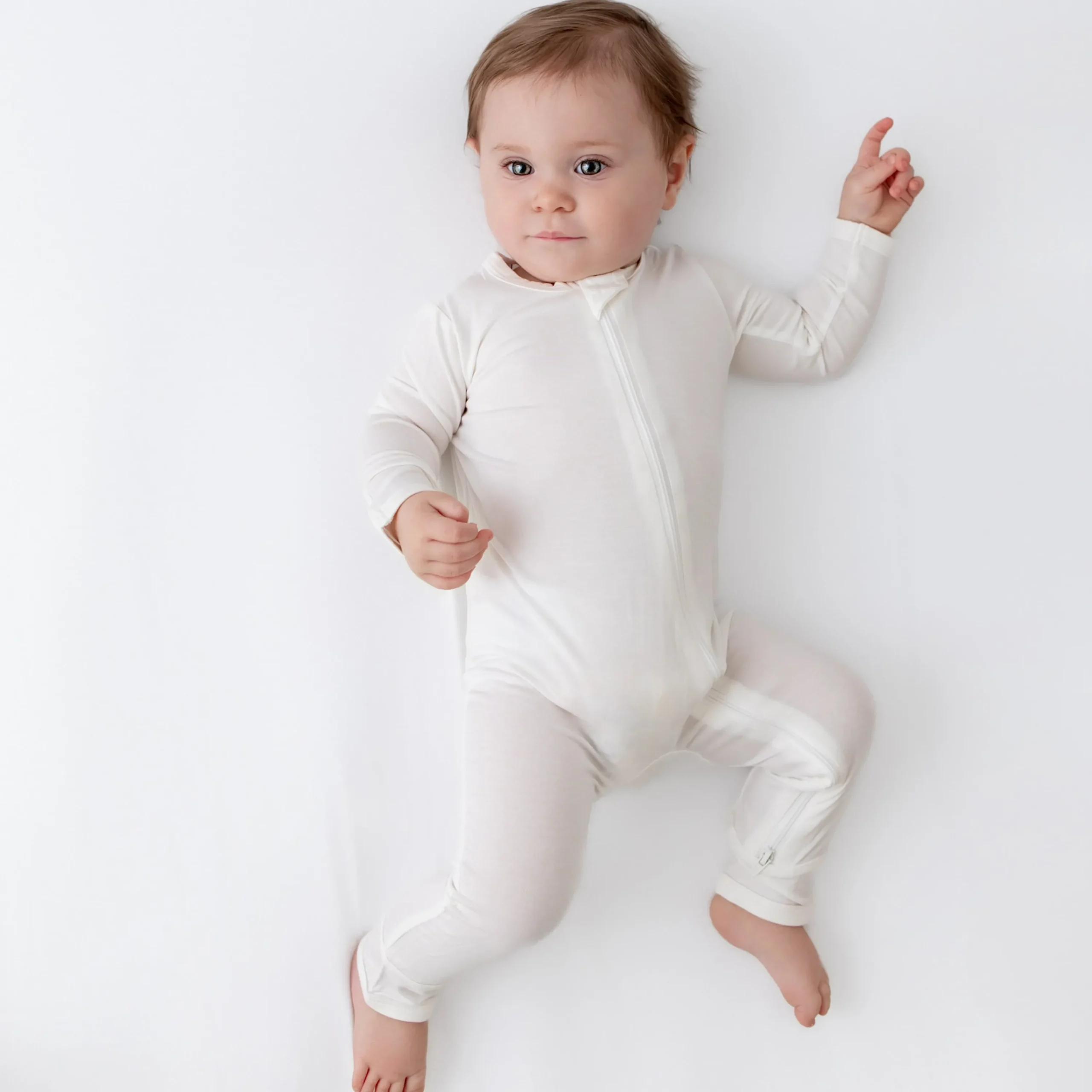 Kyte Baby Zippered Romper in Cloud Hot